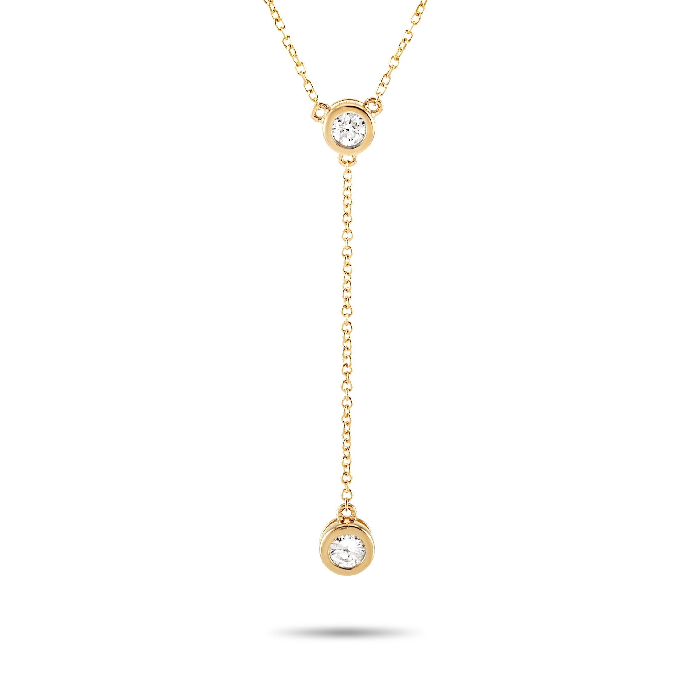 This LB Exclusive necklace is made of 14K yellow gold and embellished with diamonds that total 0.20 carats. The necklace weighs 1.7 grams and boasts a 15” chain and a pendant that measures 1.50” in length and 0.13” in width.

Offered in brand new