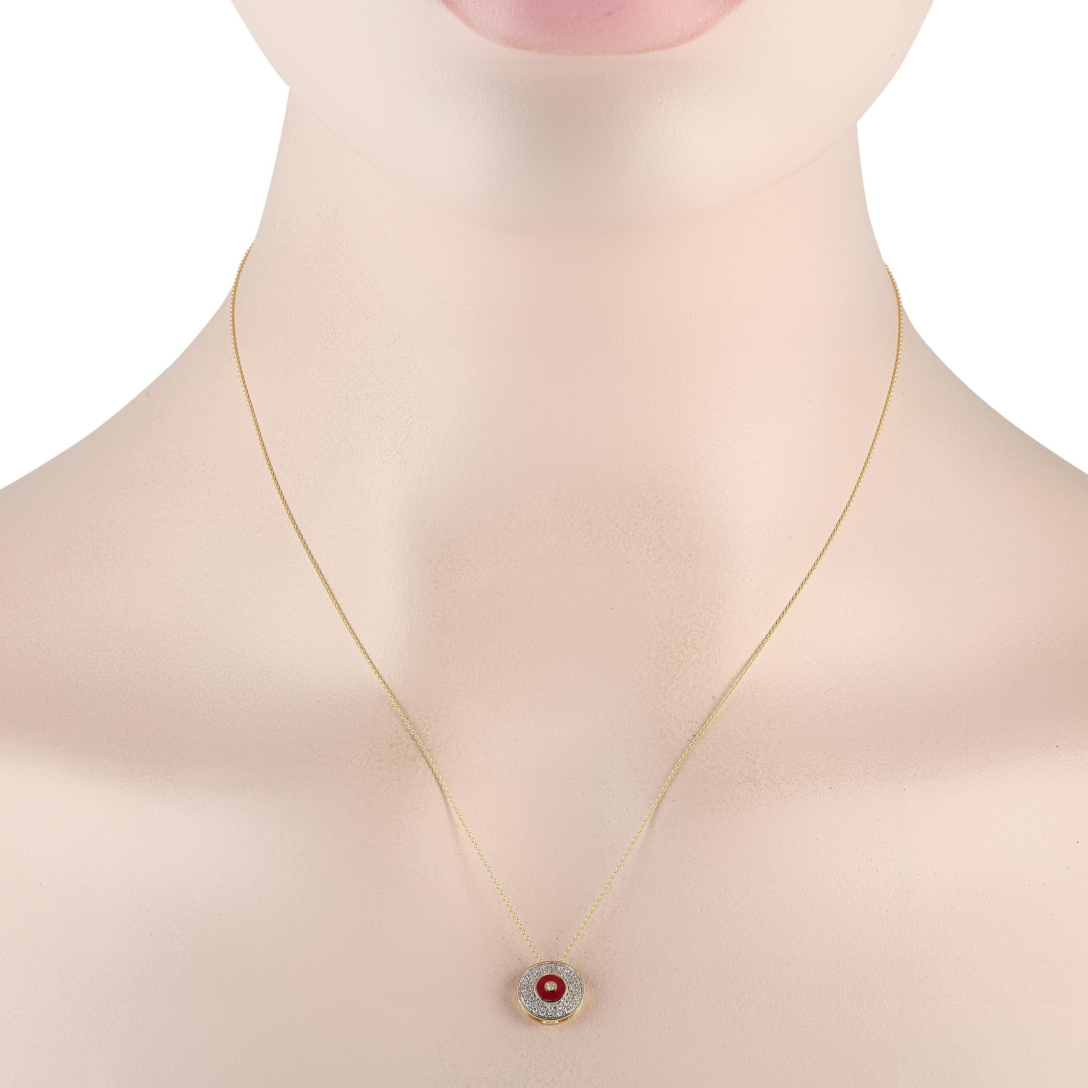 A circular pendant measuring 0.45 round serves as a stunning focal point on this elegant 14K Yellow Gold necklace. Diamonds with a total weight of 0.20 carats provide plenty of sparkle, while a red accent adds the perfect pop of color. Its attached