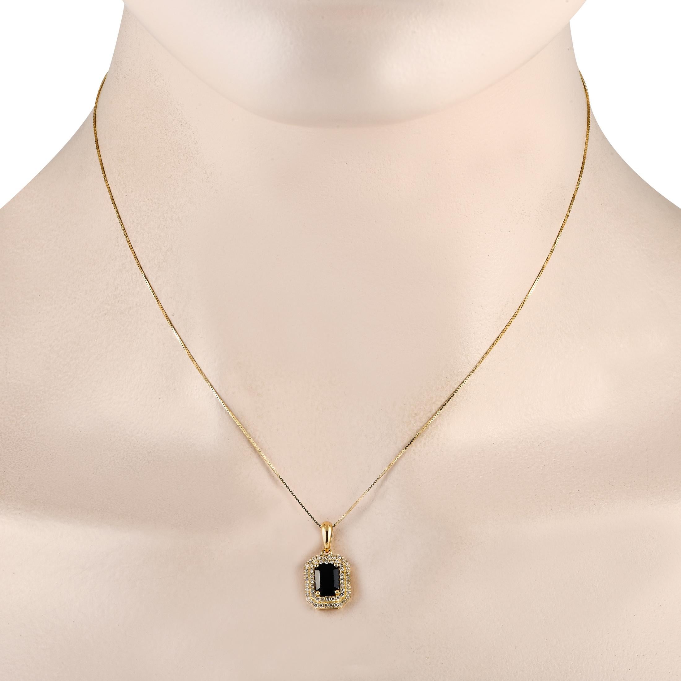 Make a statement by adding this impeccably crafted necklace to any ensemble. Breathtaking and elegant, this necklace features a 14K Yellow Gold pendant measuring 0.75 long by 0.45 wide. It comes to life thanks to a striking Sapphire center stone and