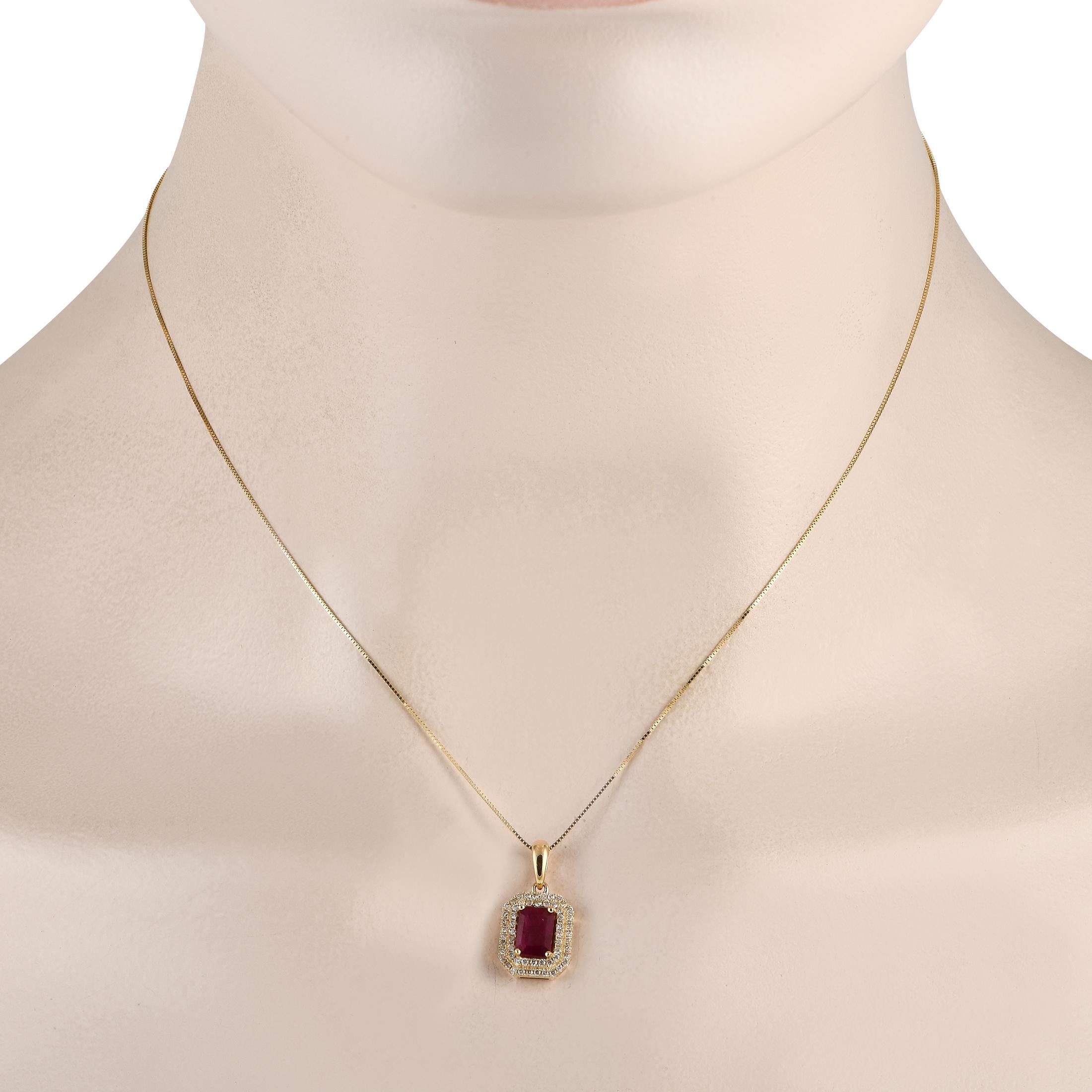 This timeless necklace will never go out of style. Suspended from a sleek 16 box chain, a 14K Yellow Gold pendant measuring 0.75 long by 0.45 wide makes a statement thanks to a stunning Ruby center stone and Diamond accents totaling 0.24 carats.This