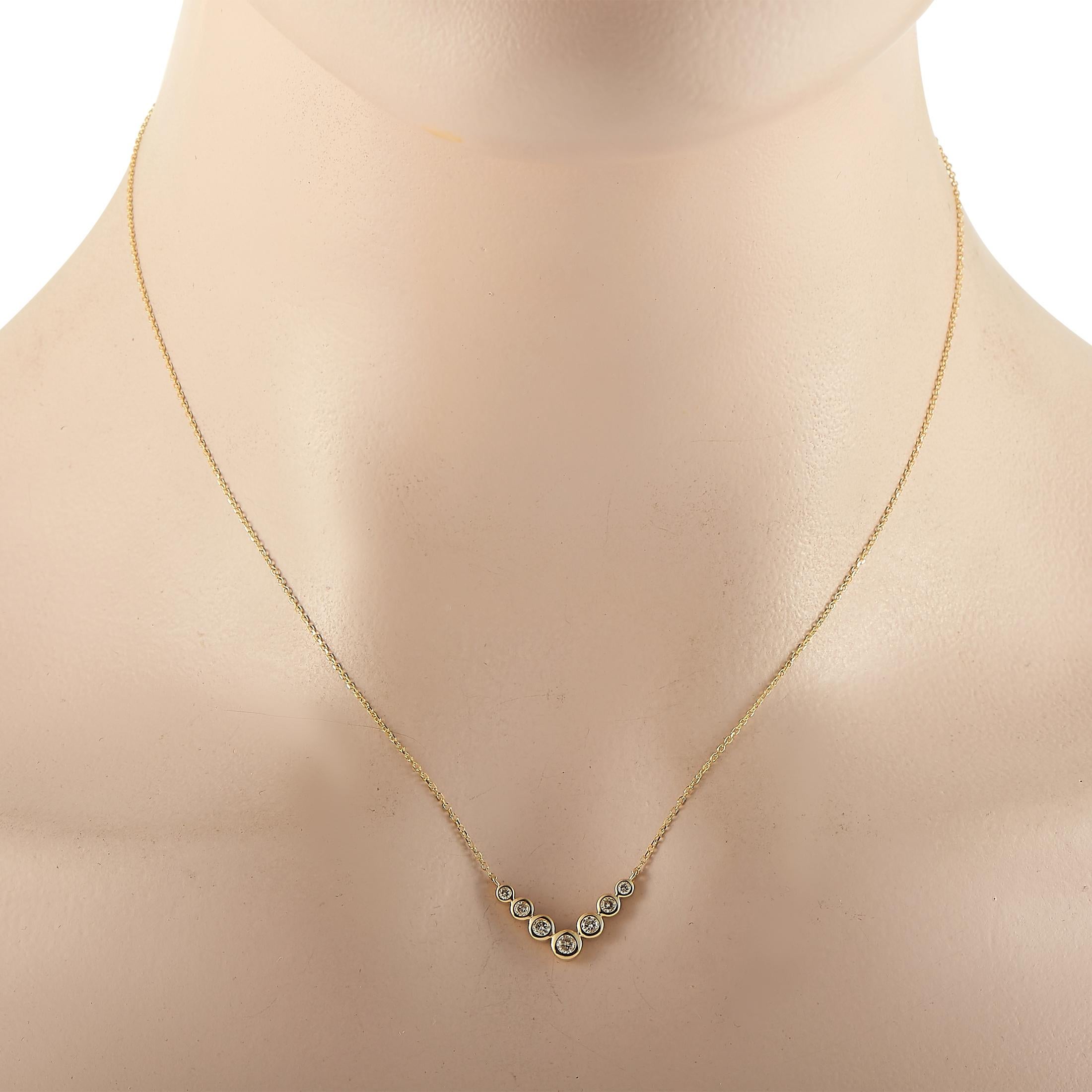 This LB Exclusive necklace is crafted from 14K yellow gold and weighs 2 grams. It is presented with a 16” chain and boasts a pendant that measures 0.50” in length and 0.75” in width. The necklace is set with diamonds that total 0.25 carats.
 
