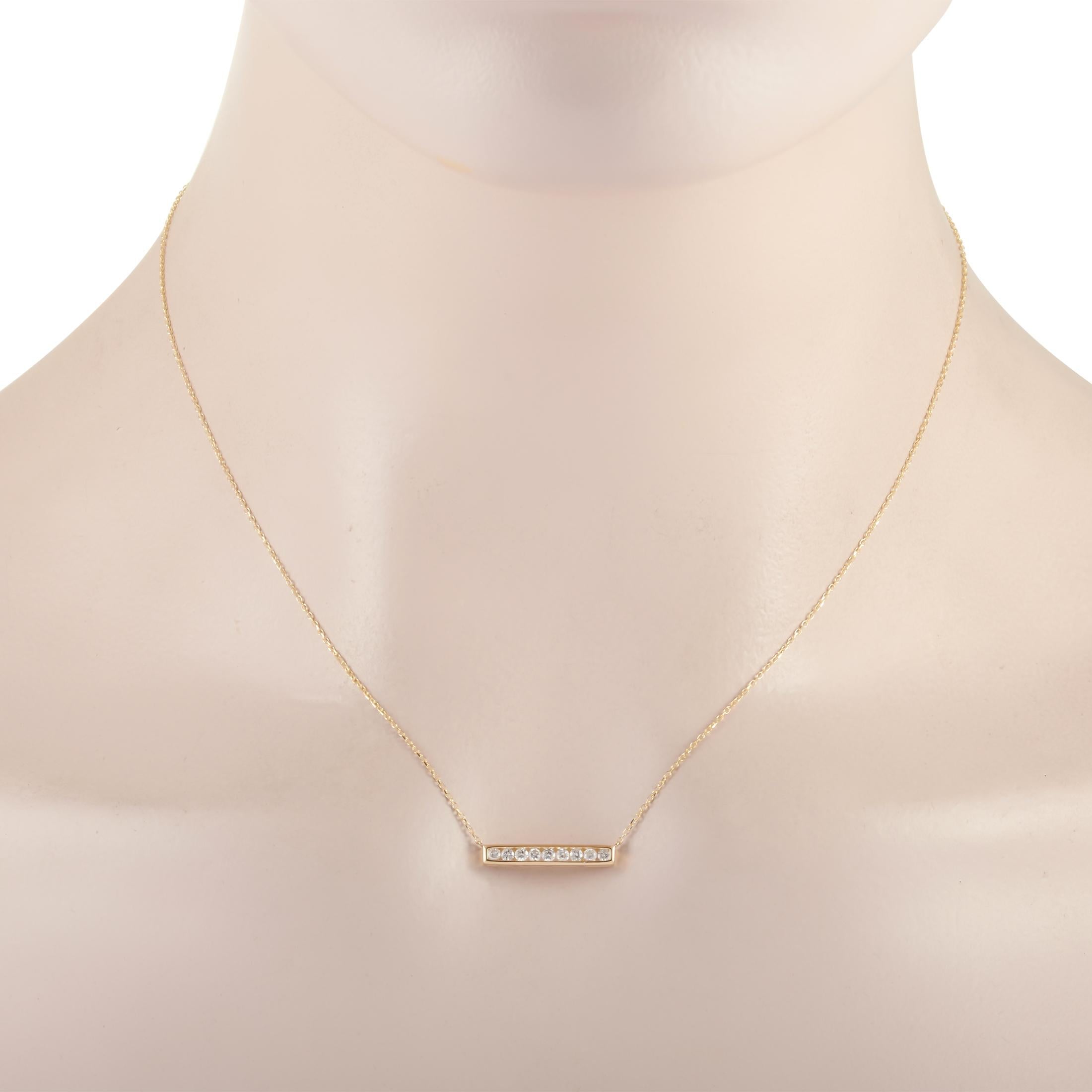 This LB Exclusive necklace is made of 14K yellow gold and embellished with diamonds that amount to 0.25 carats. The necklace weighs 1.8 grams and boasts a 15” chain and a pendant that measures 0.13” in length and 0.75” in width.
 
 Offered in brand
