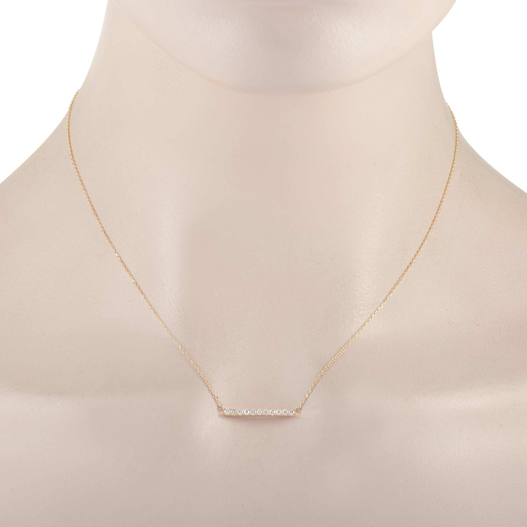 This LB Exclusive necklace is crafted from 14K yellow gold and weighs 2 grams. It is presented with a 15” chain and boasts a pendant that measures 0.07” in length and 0.75” in width. The necklace is set with diamonds that total 0.25 carats.

Offered