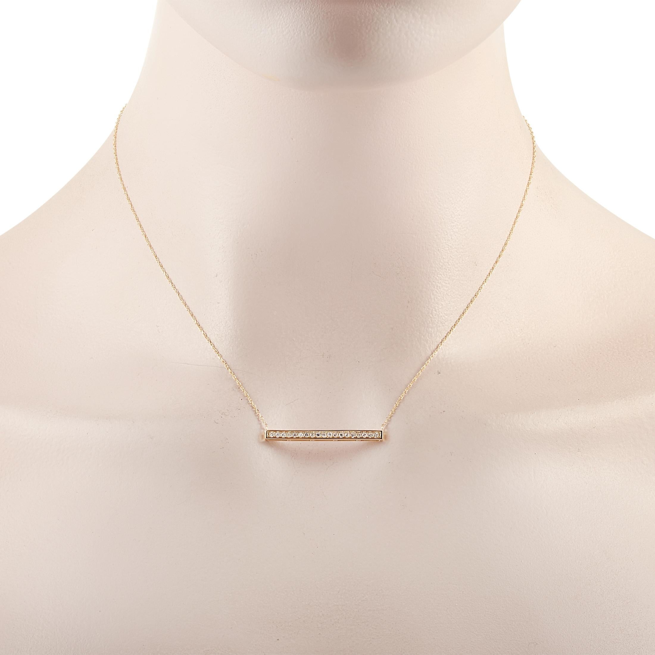 This LB Exclusive necklace is crafted from 14K yellow gold and weighs 2.1 grams. It is presented with a 15” chain and boasts a pendant that measures 0.13” in length and 1.25” in width. The necklace is set with diamonds that total 0.25
