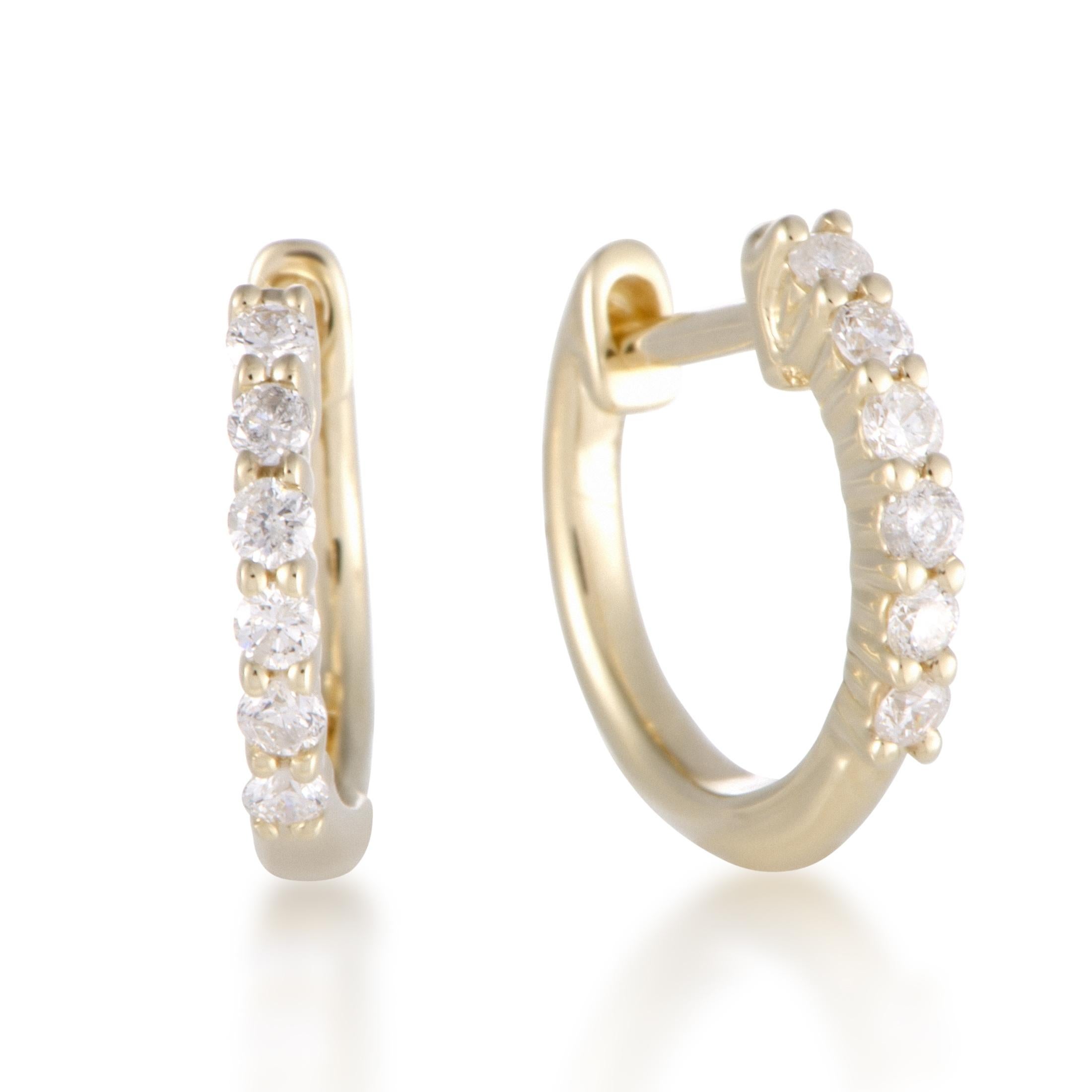 Designed in a fascinatingly refined, charmingly feminine and luxuriously lustrous manner, these nifty earrings are made of radiant 14K yellow gold and embellished with sparkling diamonds amounting to 0.25ct.