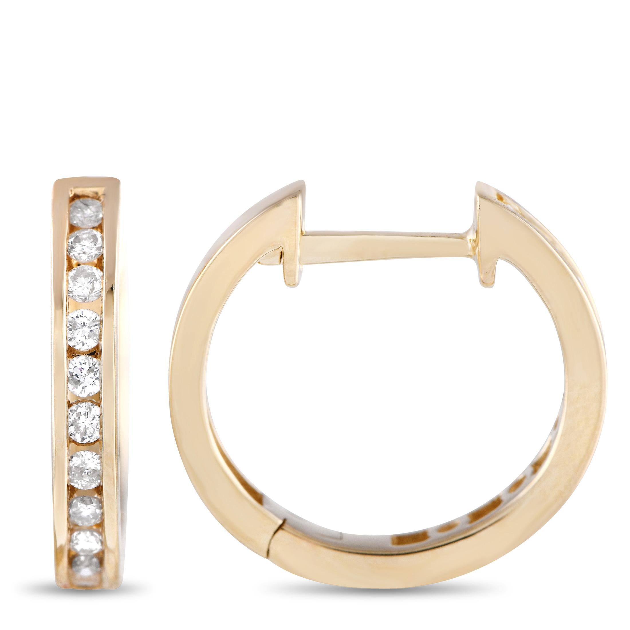 Channel-set diamonds with a total weight of 0.25 carats make these hoop earrings undeniably elegant. Sleek and sophisticated in design, each one features a simple 14K Yellow Gold setting measuring 0.60” round. 

This jewelry piece is offered in