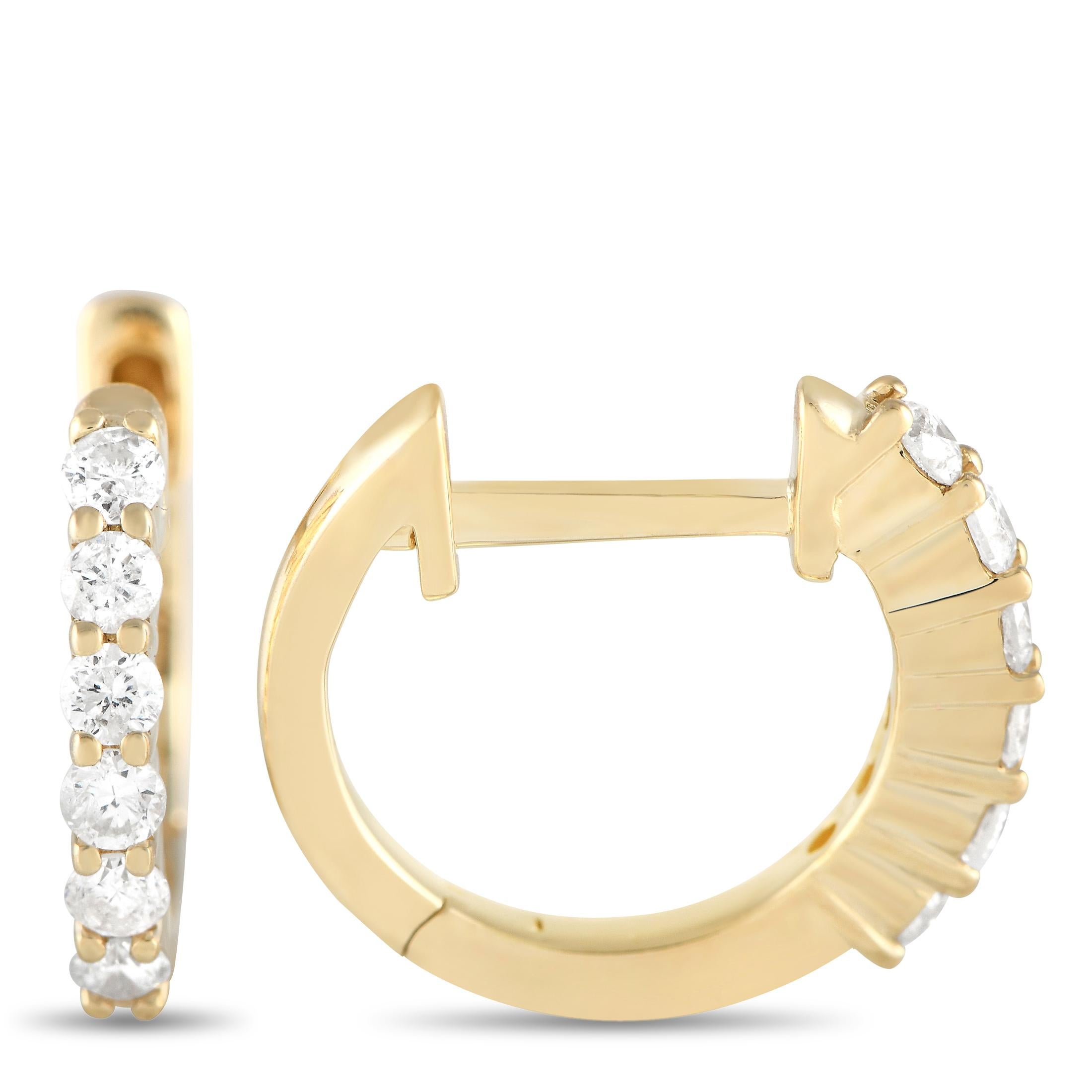 Sparkling round-cut diamonds totaling 0.25 carats make these elegant hoop earrings the perfect addition to any outfit. Simple, elegant, and incredibly chic, each one features a classic 14K Yellow Gold setting that measures 0.50” round. 

This
