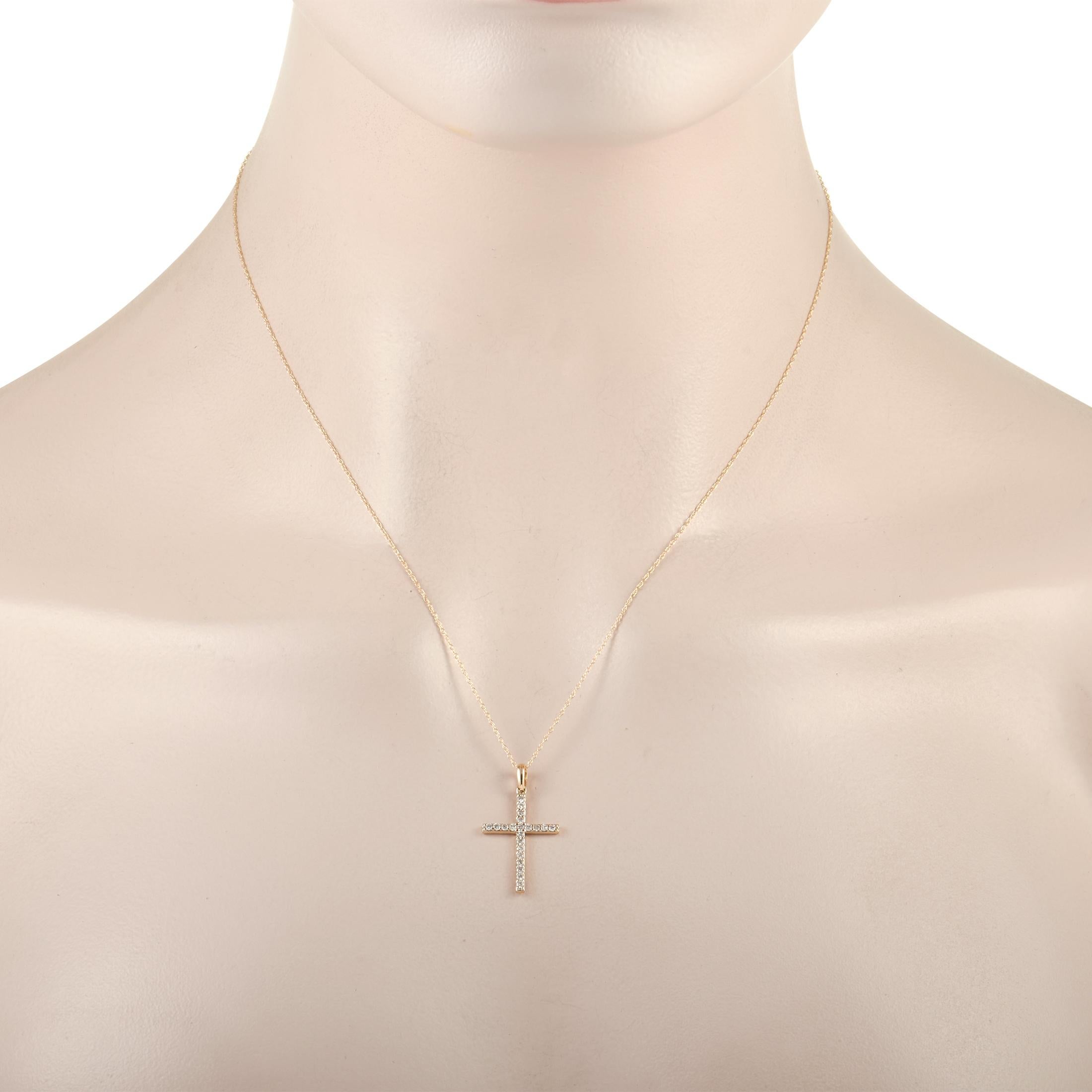 Shimmering diamonds totaling 0.26 carats elevate this iconic piece of jewelry. The cross shaped pendant measures 1” long, .5” wide, and is suspended from a 17.5” chain with secure spring ring closure. Crafted from 14K Yellow Gold, this is a