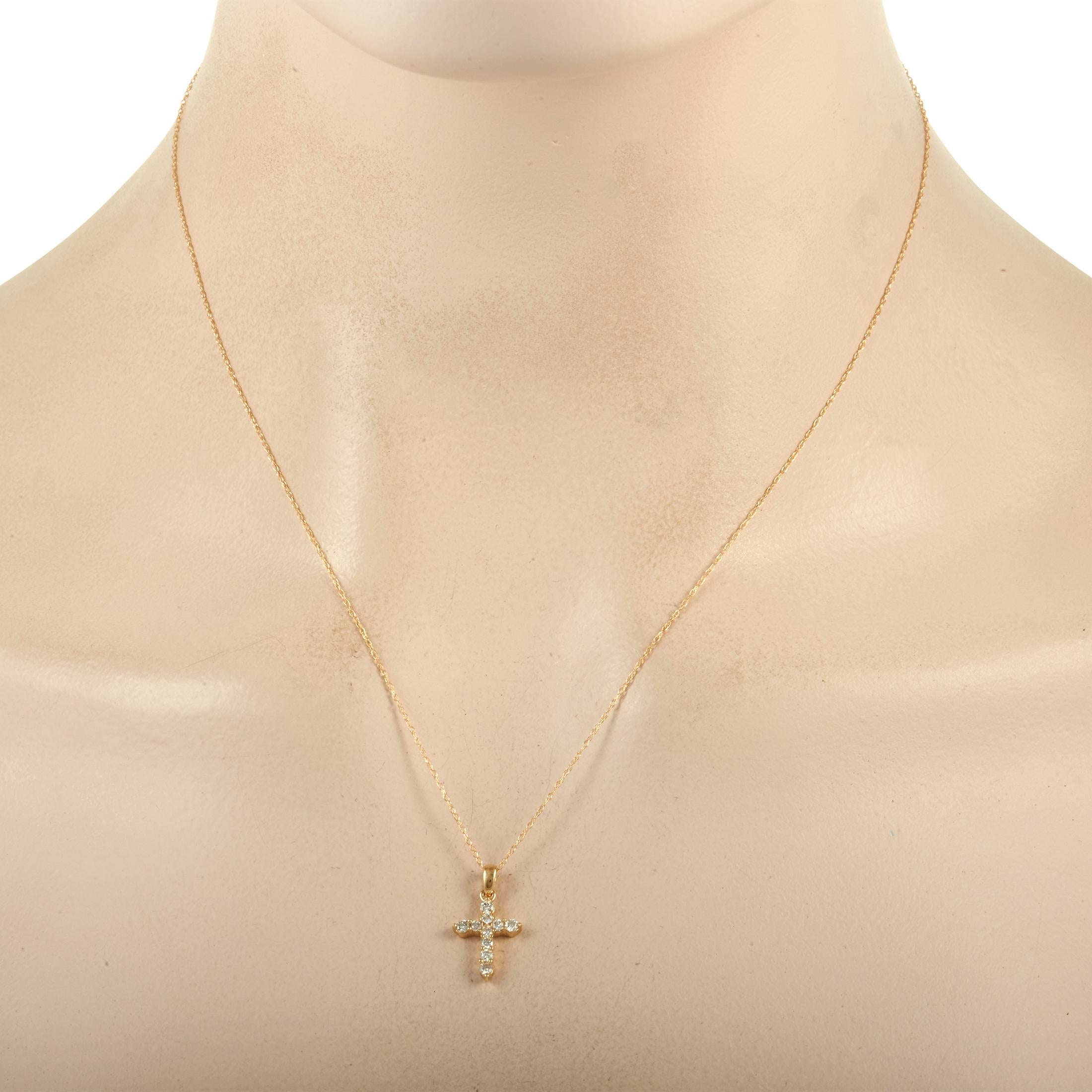 This jewel isn't just about styling your outfit; it also speaks of your personal belief and faith. The yellow gold necklace chain measures 18 inches long and it holds a 0.75-inch by 0.45-inch cross pendant adorned with 0.27 ct of white diamonds.