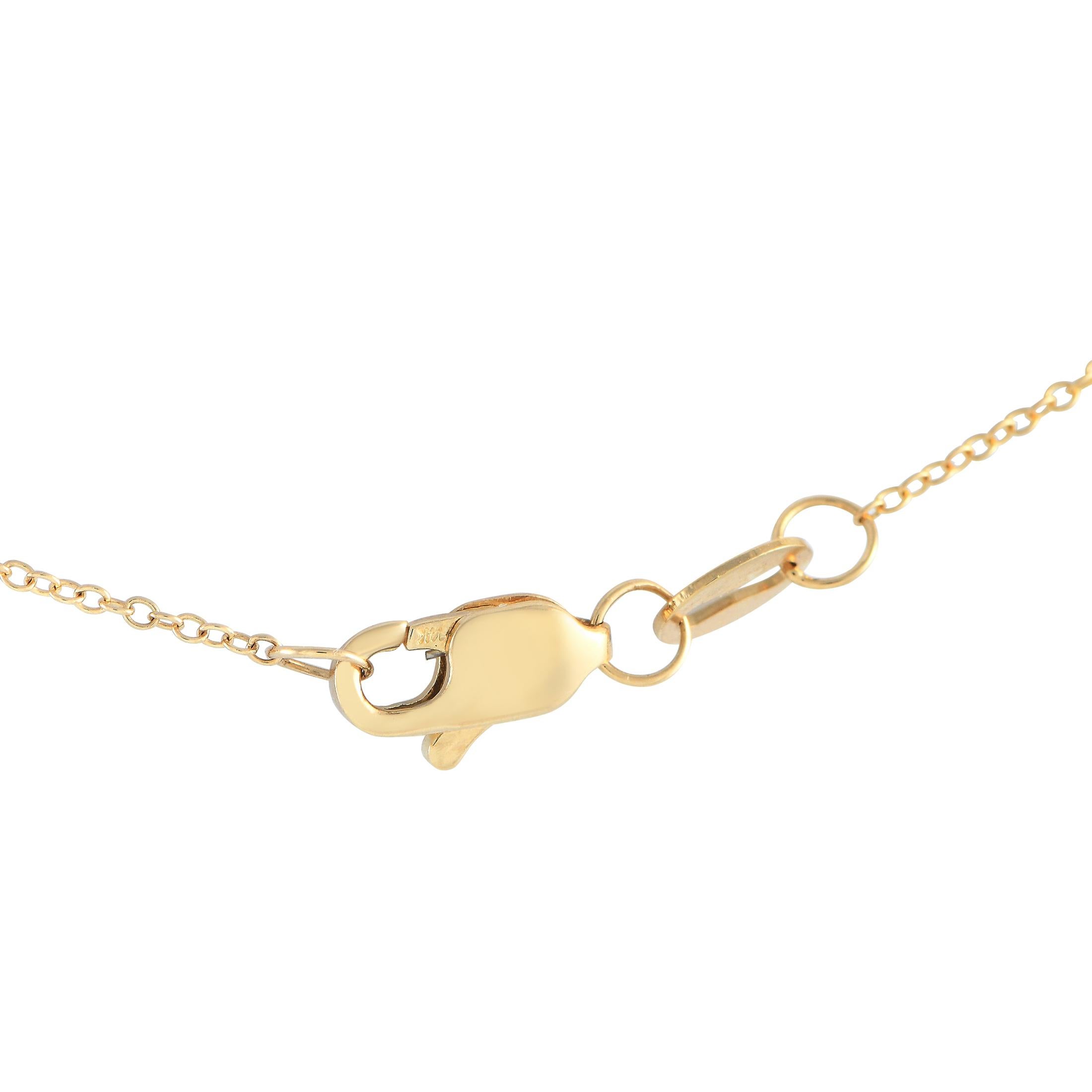 Simple yet detailed, this yellow gold necklace is able to display class and elegance without being flashy. It features a delicate 14K yellow gold cable chain with a lobster clasp and a round pendant. A combination of round and step-cut diamonds