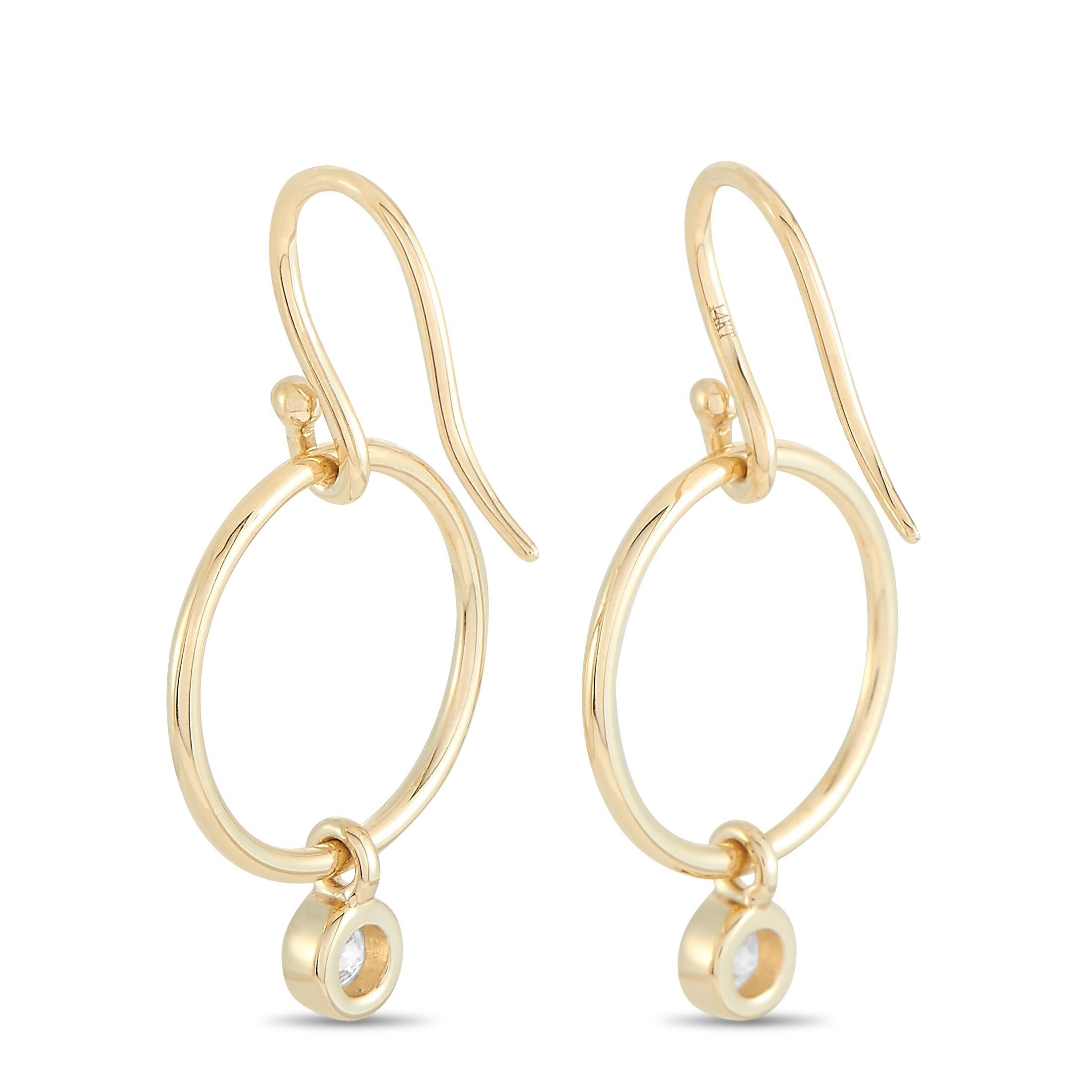 These LB Exclusive earrings are made of 14K yellow gold and embellished with diamonds that total 0.32 carats. The earrings measure 1.25” in length and 0.65” in width and each of the two weighs 1.4 grams.
 
 The pair is offered in brand new condition