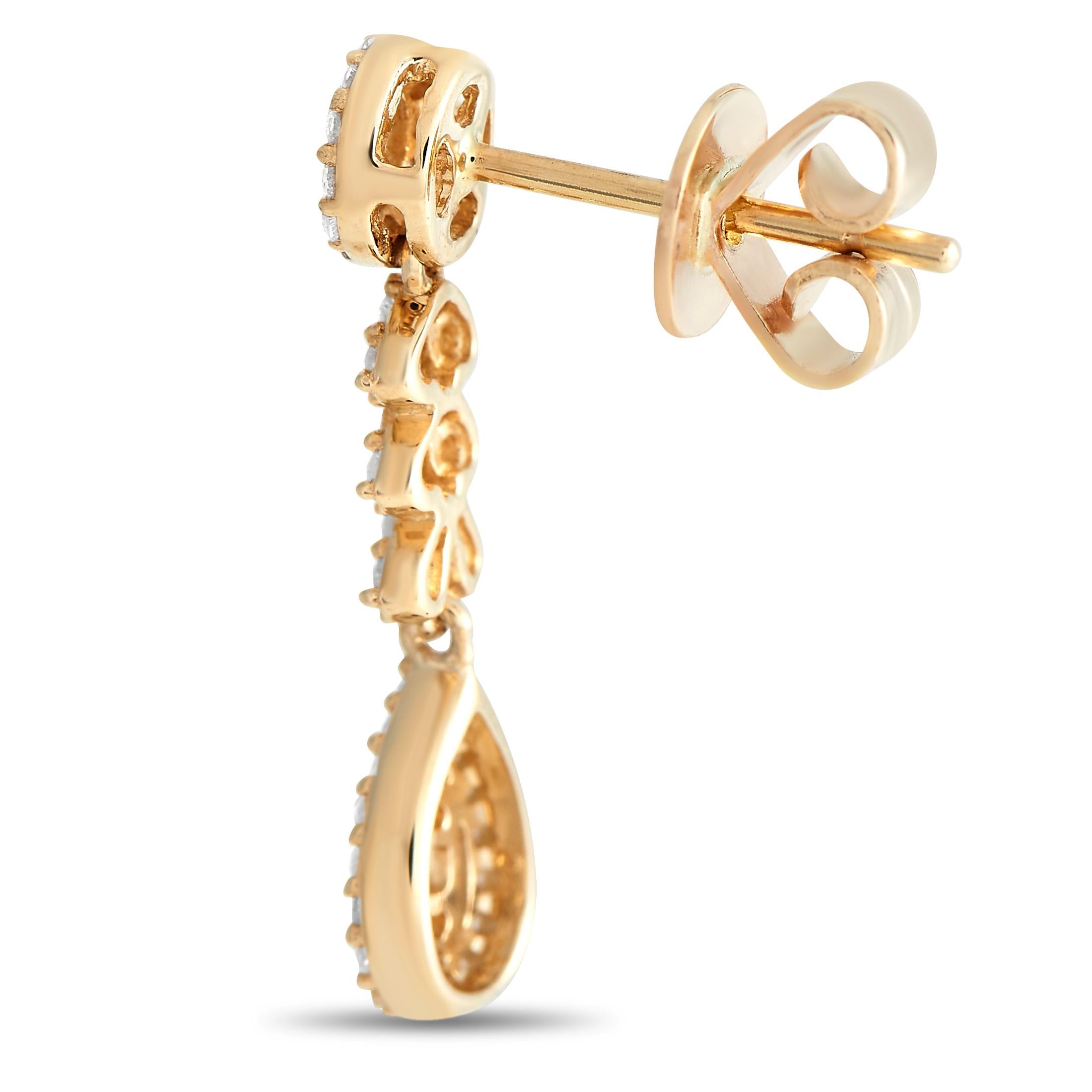 Diamonds with a total weight of 0.35 carats make these earrings simply unforgettable. A classic accessory that will continually impress, each one features a detailed 14K yellow gold setting that measures 0.80” long and 0.25” wide. 
 
 This jewelry