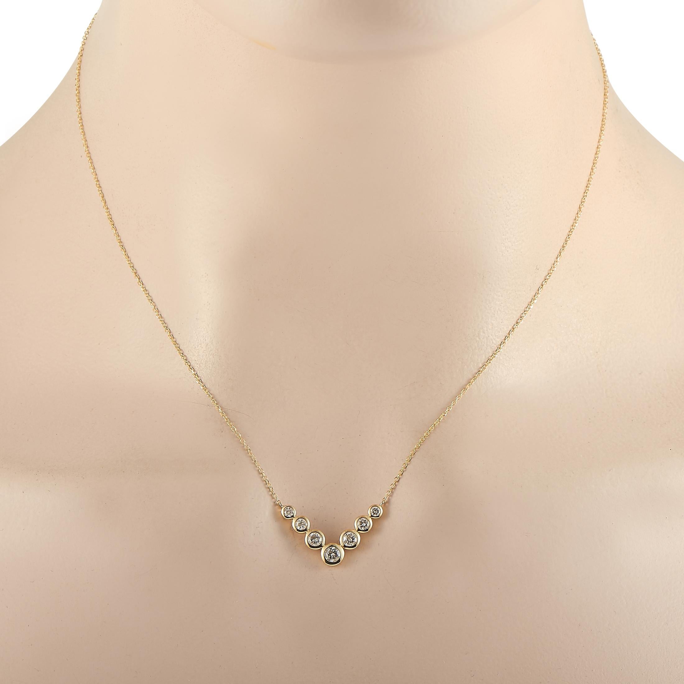 This LB Exclusive necklace is made of 14K yellow gold and embellished with diamonds that amount to 0.50 carats. The necklace weighs 2.4 grams and boasts a 16” chain and a pendant that measures 0.55” in length and 1” in width.
 
 Offered in brand