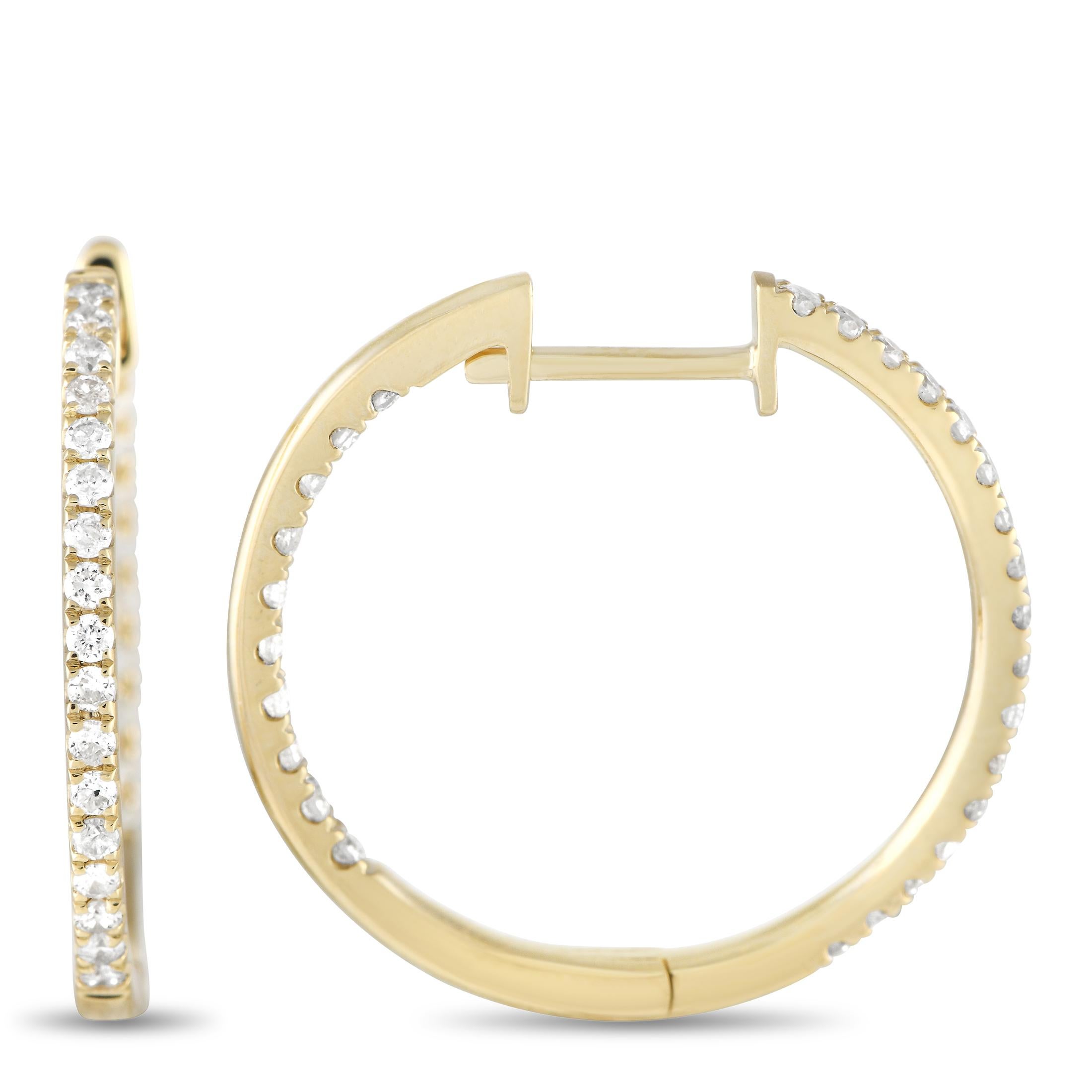 These dazzling hoop earrings are poised to put the perfect finishing touch on any ensemble. Diamonds with a total weight of 0.50 carats sparkle on seemingly every inch of these elegant earrings. Each one features a 14K Yellow Gold setting and