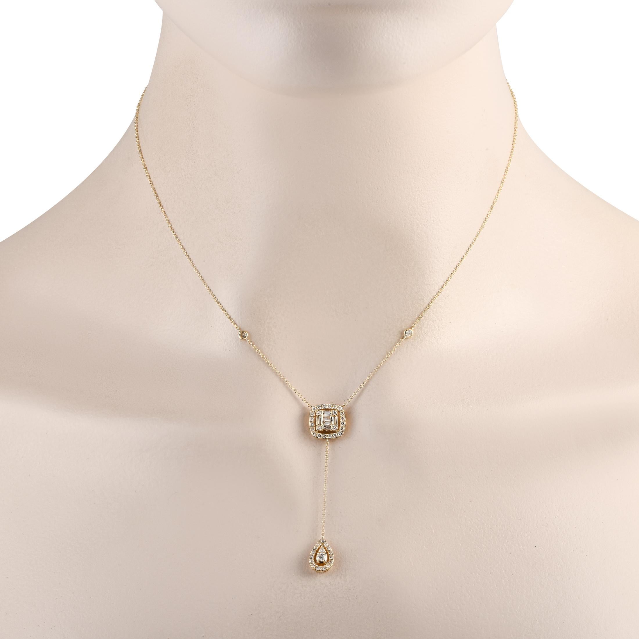 This delicate necklace will add the perfect finishing touch to any ensemble. Crafted from 14K Yellow Gold, the 15 chain includes a dangling pendant measuring 2 long. Sparkling Diamonds totaling 0.65 carats provide an additional touch of luxury.This