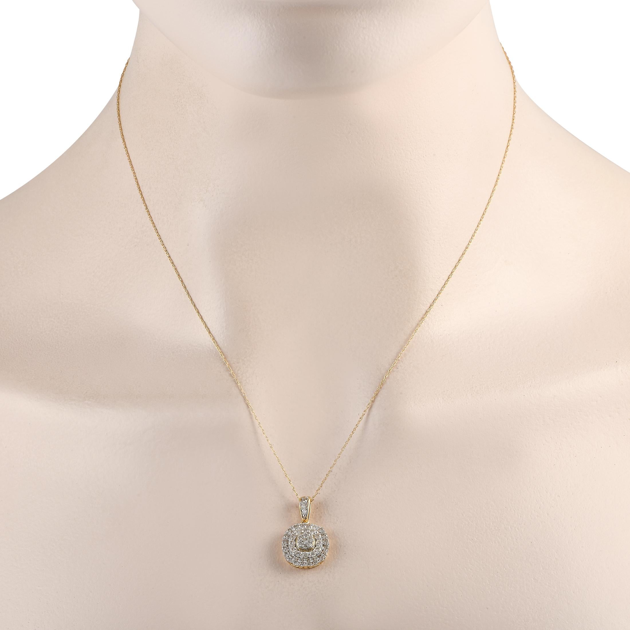 This exquisite necklace is poised to put the perfect finishing touch on any ensemble. On this pieces pendant, sparkling Diamonds with a total weight of 0.75 carats allow it to effortlessly radiate light. The pendant is crafted from 14K Yellow Gold