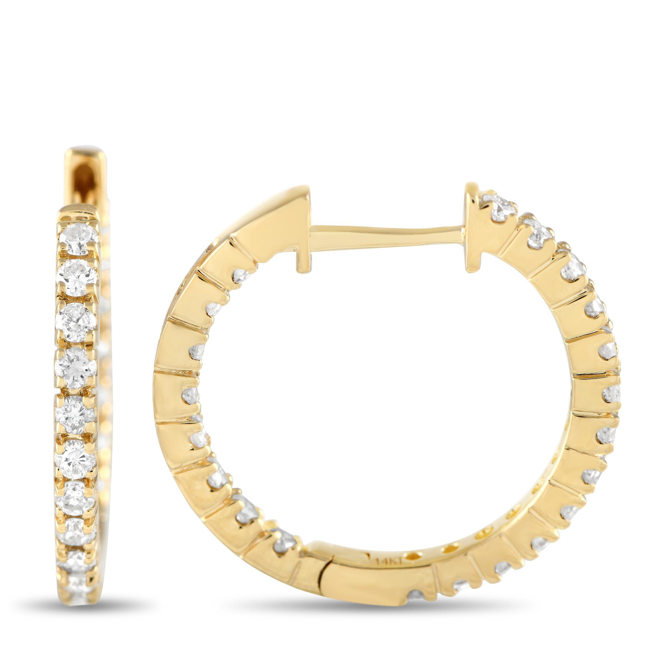 Add elegance to your everyday outfits with these diamond hoop earrings. Each hoop is crafted in 14K yellow gold and decorated with a row of diamonds on the front face and on the front-facing back side. Also called inside-out hoops, these sparkly