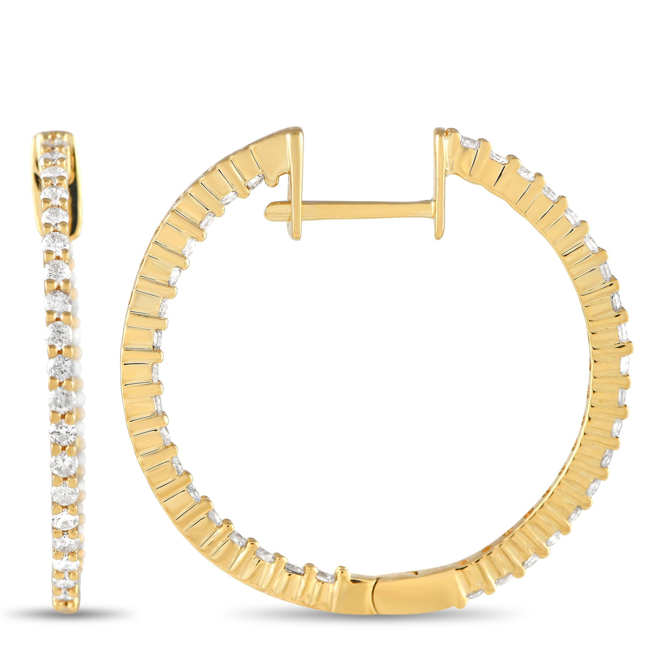 Here is a classy pair of hoops that will frame your face and bring just the right touch of sparkle to your wardrobe. The slim hoops are fashioned in 14K yellow gold and feature bright white diamonds in shared prongs. The sparkling gems line the