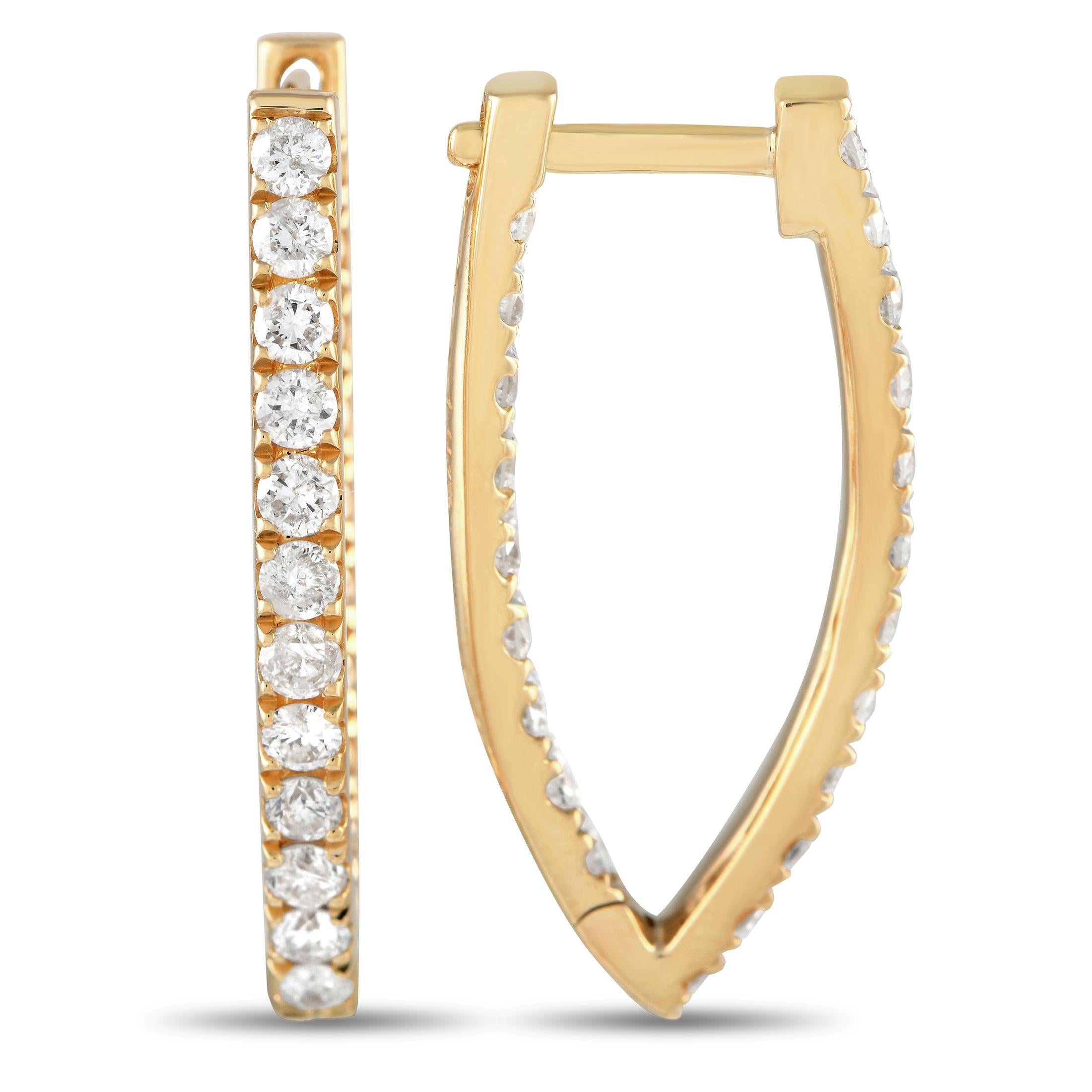 These luxurious 14K yellow gold earrings will continually catch the light thanks to sparkling diamonds with a total weight of 1.52 carats. Each one measures 1.0 long by 0.50 wide.This jewelry piece is offered in brand new condition and includes a