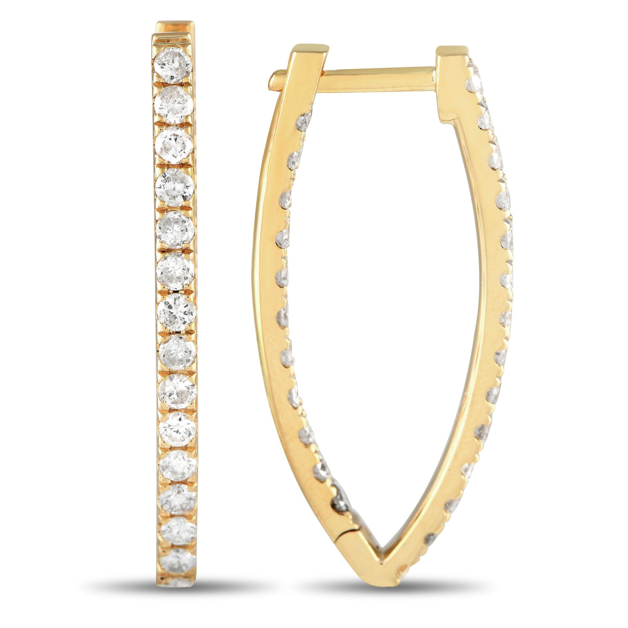 Add sparkle to any ensemble by adding these sophisticated earrings. Each one features a sleek, simple 14K yellow gold setting that measures 1.25 long by 0.60 wide. Diamonds with a total weight of 1.78 carats make them impossible to ignore.This
