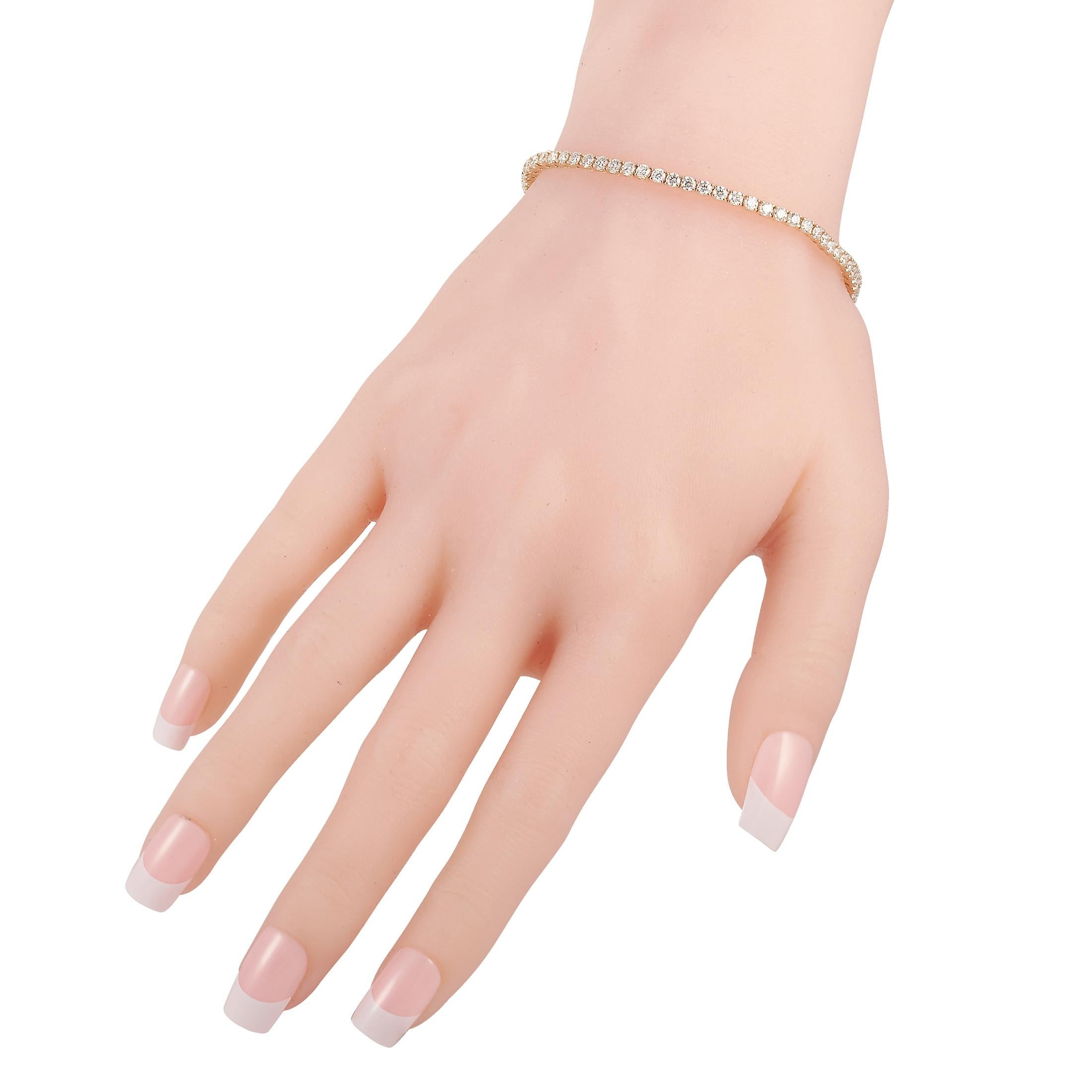 This LB Exclusive tennis bracelet is made of 14K yellow gold and embellished with diamonds that amount to 2.94 carats. The bracelet weighs 7.3 grams and measures 7.50” in length.
 
 Offered in brand new condition, this jewelry piece includes a