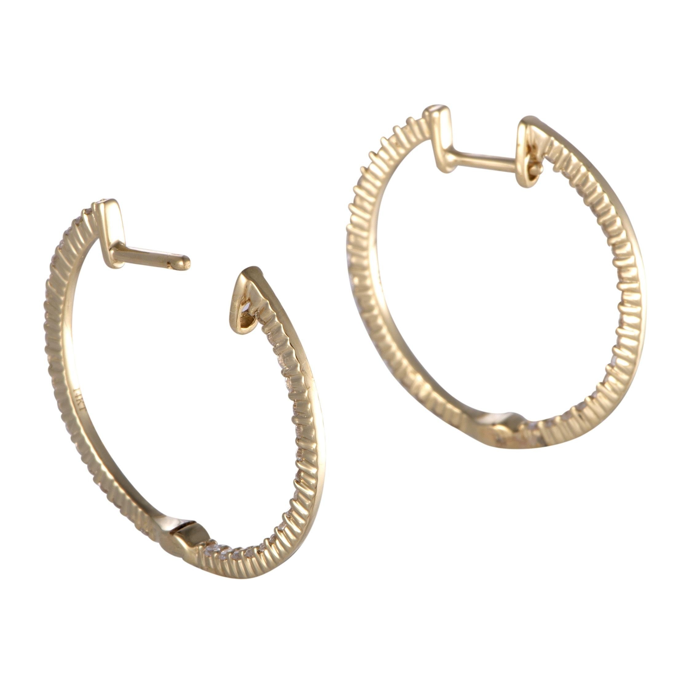Employing the classically appealing blend of radiant 14K yellow gold and prestigiously resplendent diamonds amounting to 0.75ct, these tasteful earrings offer an appearance of understated femininity.