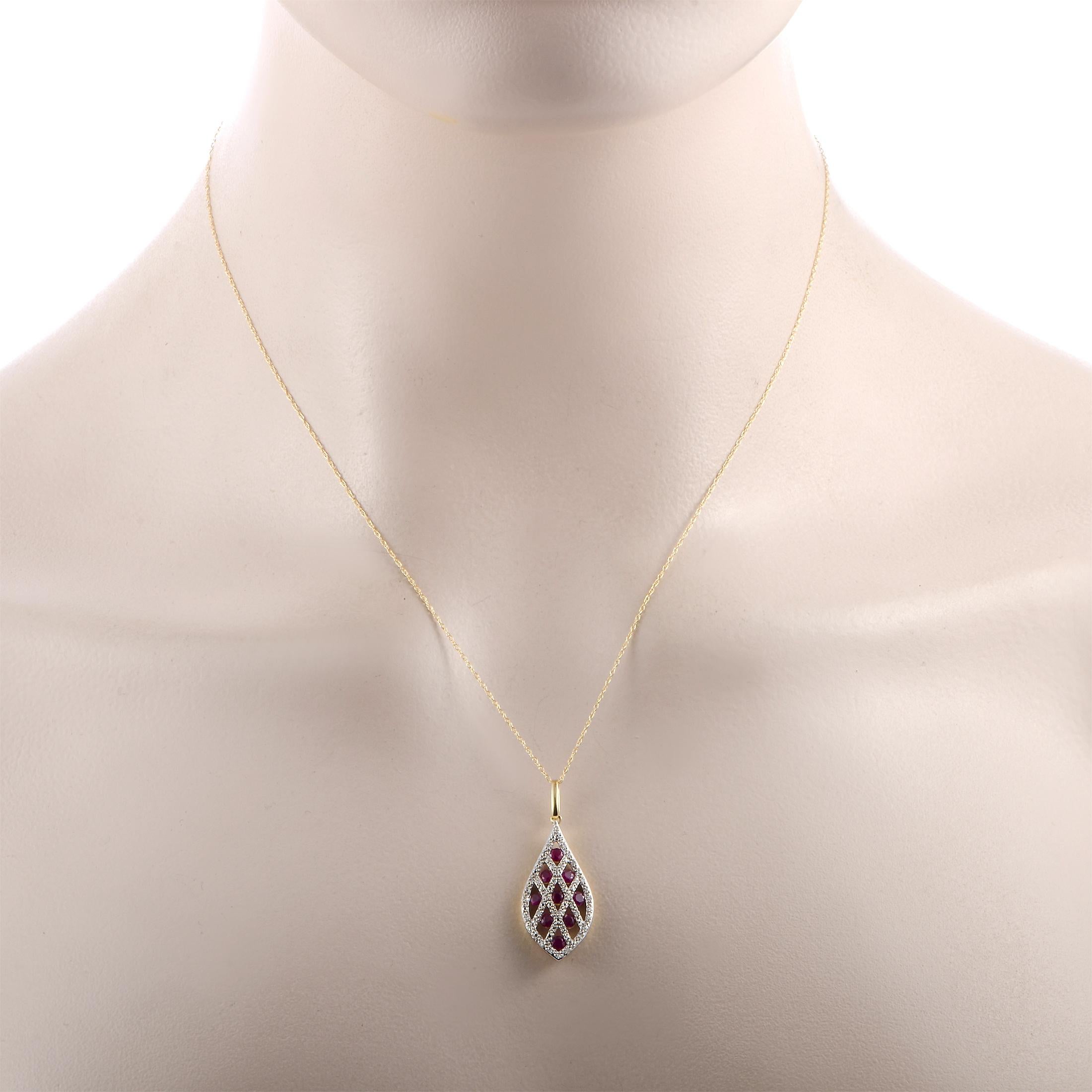 This LB Exclusive necklace is made of 14K yellow gold and boasts an 18” chain and a pendant that measures 1.25” in length and 0.50” in width. The necklace weighs 2.9 grams. It is set with rubies and a total of 0.13 carats of diamonds.

Offered in