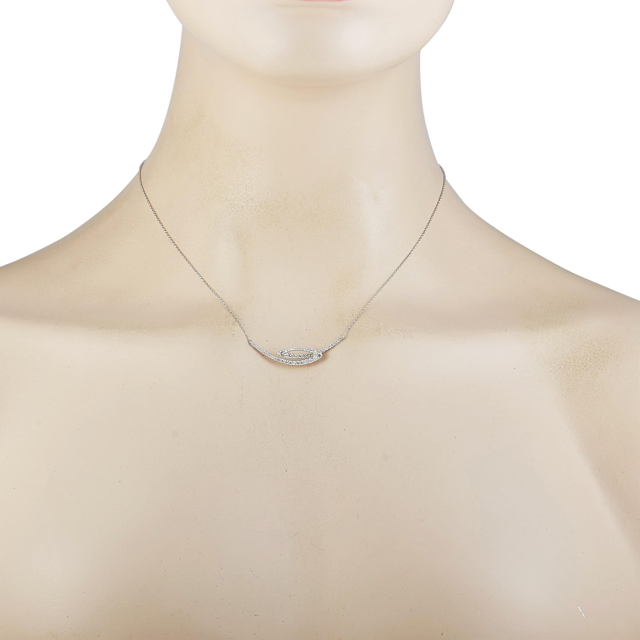 This LB Exclusive necklace is made of 18K white gold and embellished with diamonds that amount to 0.48 carats. The necklace weighs 3 grams and is presented with a 15” chain, boasting a pendant that measures 1.50” in length and 0.30” in