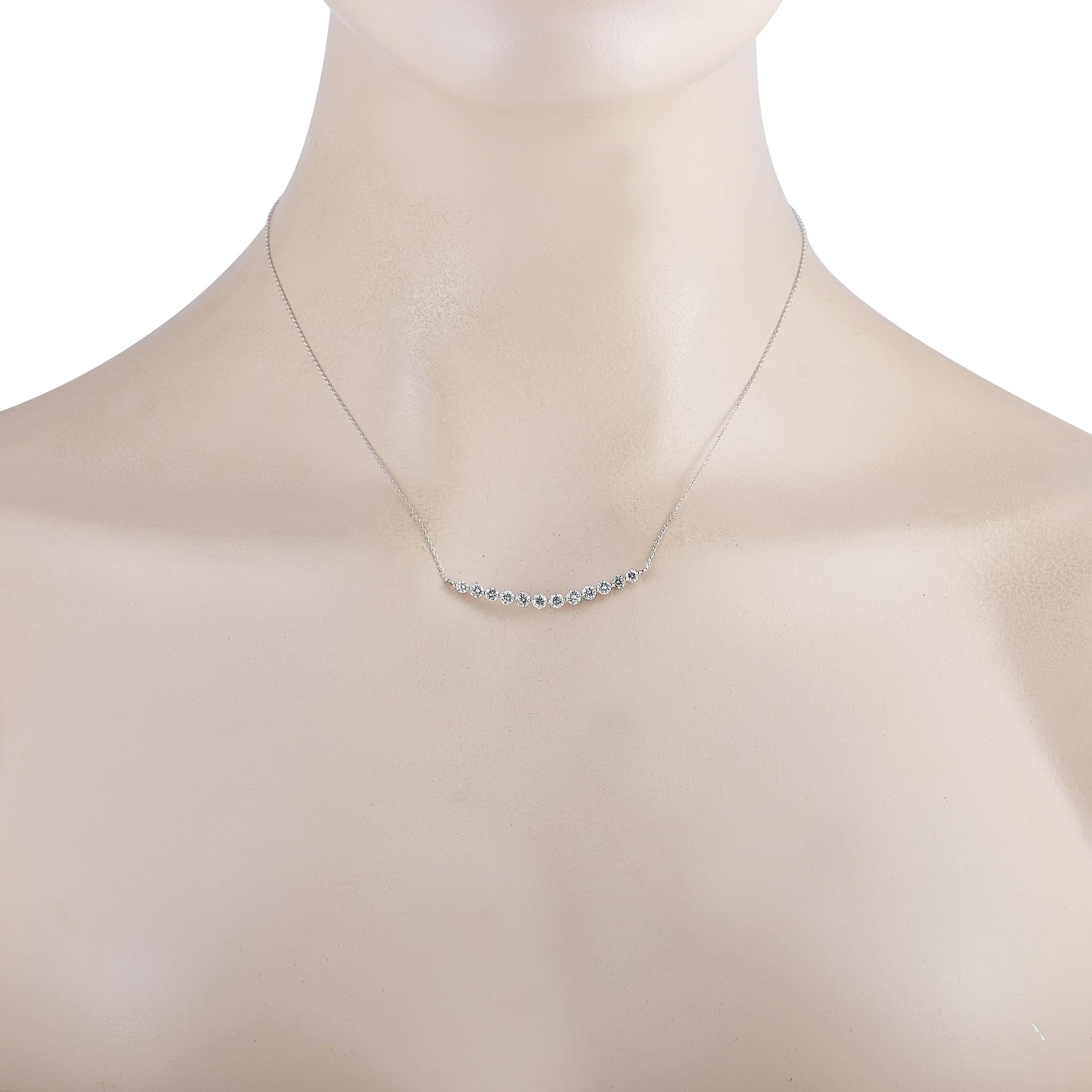 This LB Exclusive necklace is crafted from 18K white gold and weighs 2.9 grams. It is presented with a 15” chain and a pendant that measures 0.12” in length and 1.62” in width. The necklace is embellished with diamonds that total 1.30 carats.
 
