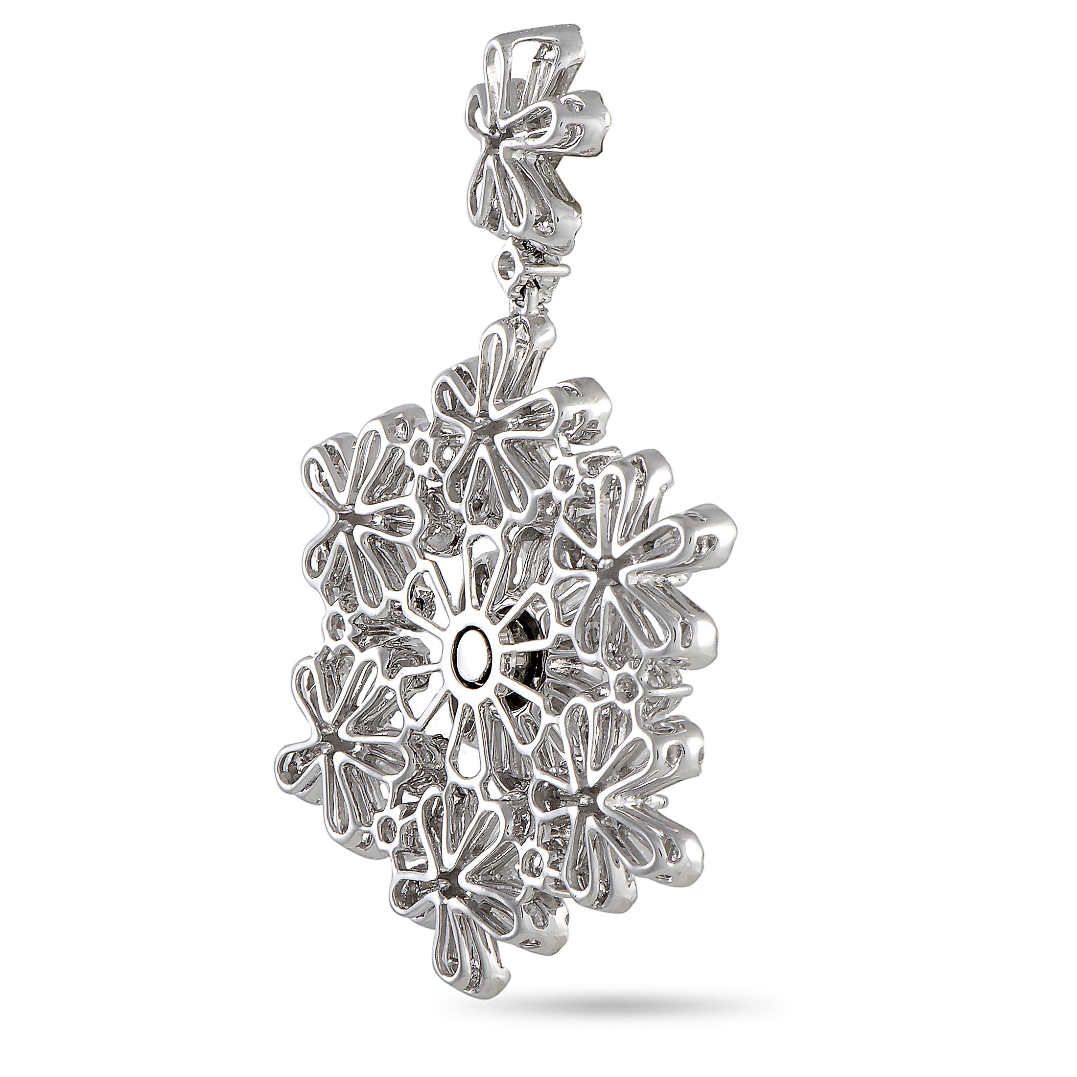 This LB Exclusive pendant is crafted from 18K white gold and weighs 18.7 grams. It is set with round and baguette diamond stones that amount to, respectively, 3.25 and 5.92 carats. The pendant measures 2.20” in length and 1.10” in width.
 
 Offered