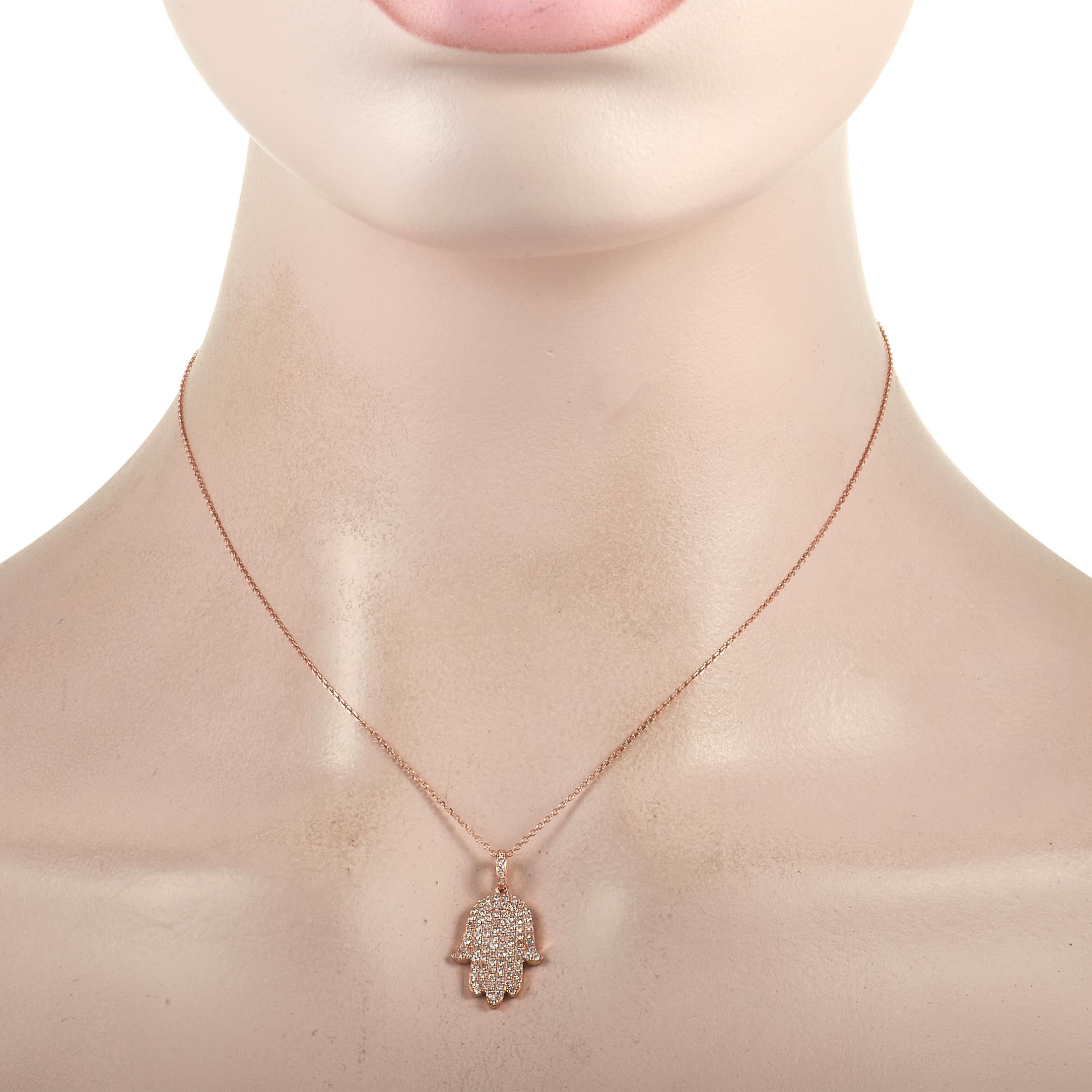 This opulent necklace is perfect for anyone who wants to express their spirituality. Shimmering 18K Rose Gold contrasts beautifully against this piece’s stunning array of diamonds, which together total 0.75 carats. The radiant Hamsa pendant measures