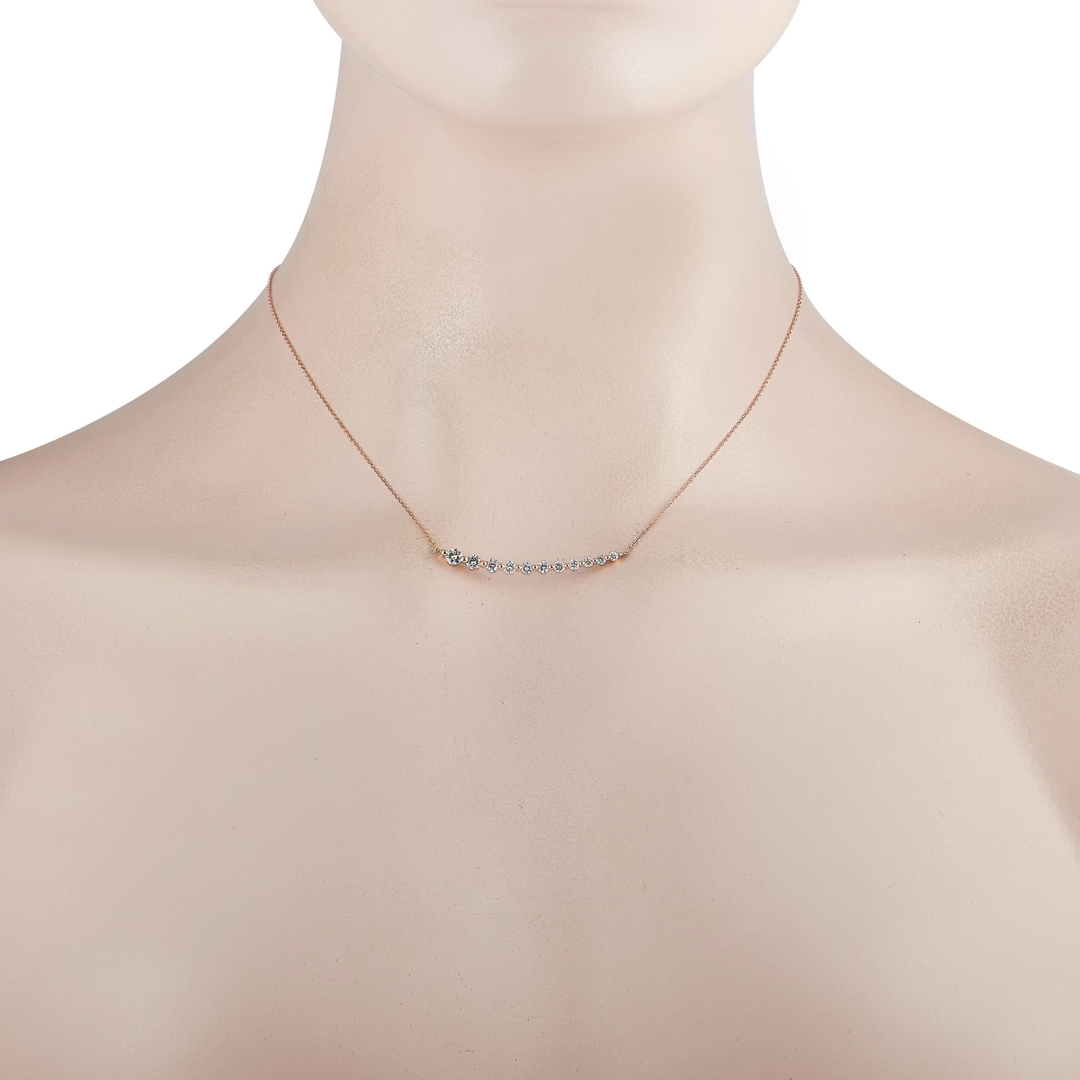 This LB Exclusive necklace is crafted from 18K rose gold and weighs 3.5 grams. It is presented with a 15” chain and a pendant that measures 1.62” in length and 0.15” in width. The necklace is embellished with diamonds that total 1.00 carat.
 
