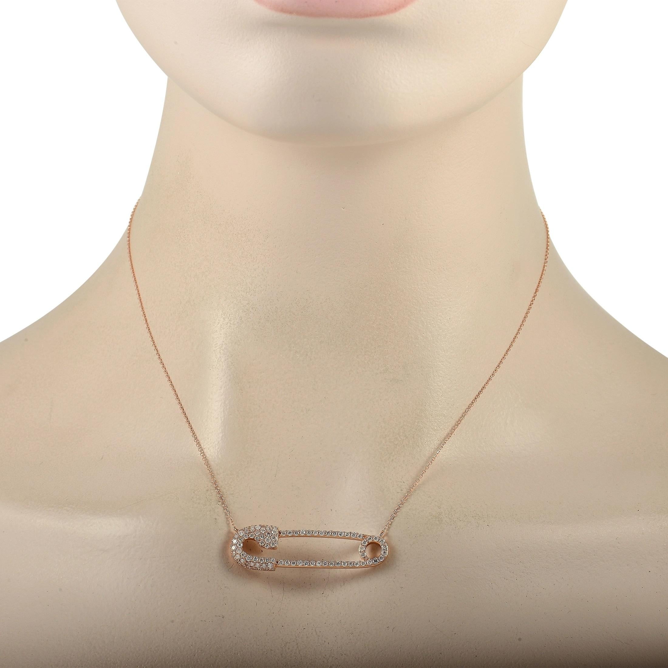 A safety pin shaped pendant measuring 1.5” long and 0.5” wide makes a statement on this charming 18K Rose Gold necklace. It sits at the center of a delicate 15” chain and comes to life thanks to glittering diamonds with a total weight of 1.0 carats.