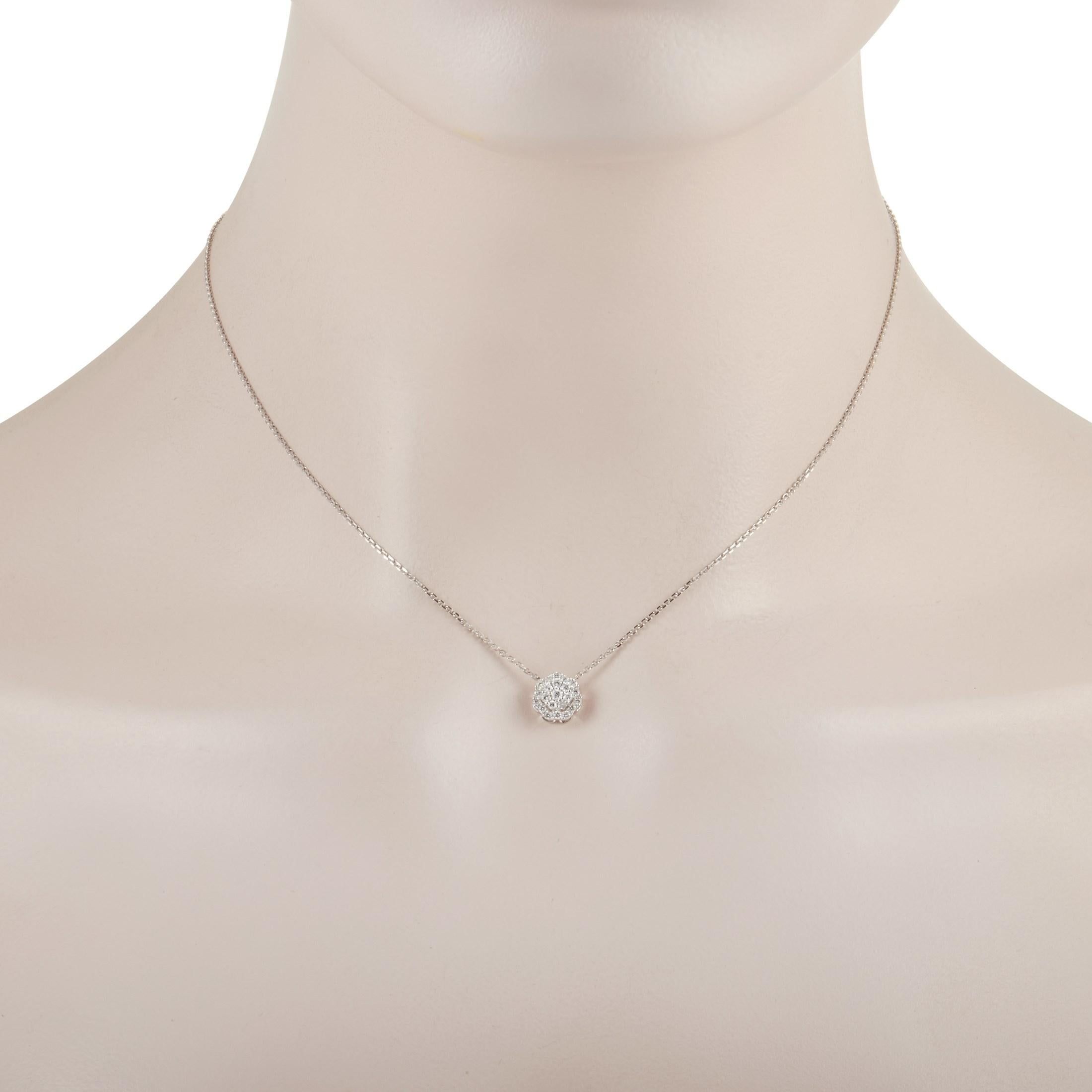 This dainty diamond pendant necklace is the perfect size for everyday wear. Crafted from 18K White Gold, it features a .25” round floral pendant suspended from a 15” chain. Glittering diamonds with a total weight of 0.27 carats add sparkle and
