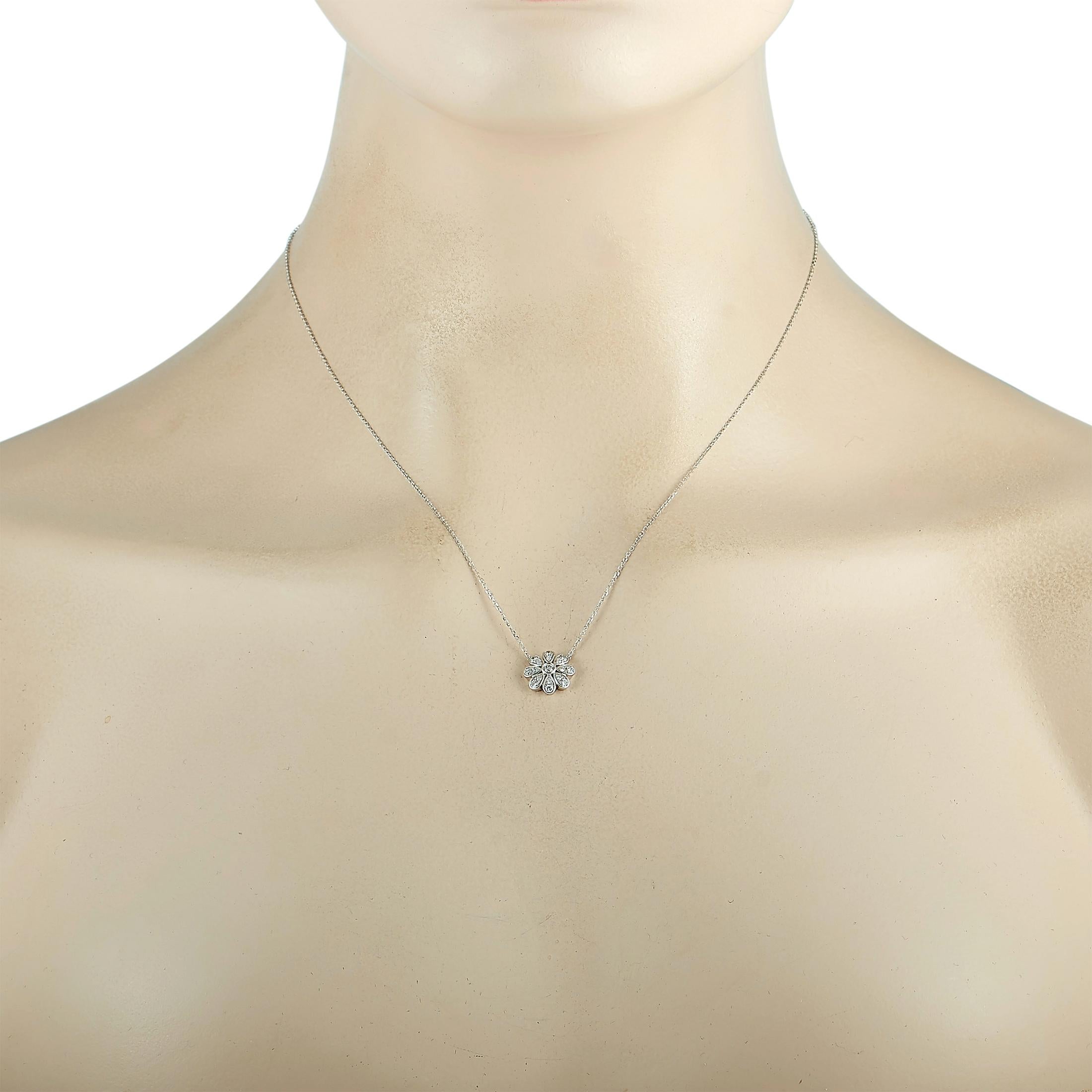 This LB Exclusive necklace is made of 18K white gold and embellished with diamonds that amount to 0.35 carats. The necklace weighs 3.2 grams and boasts an 18” chain and a flower pendant that measures 0.45” in length and 0.45” in width.
 
 Offered in