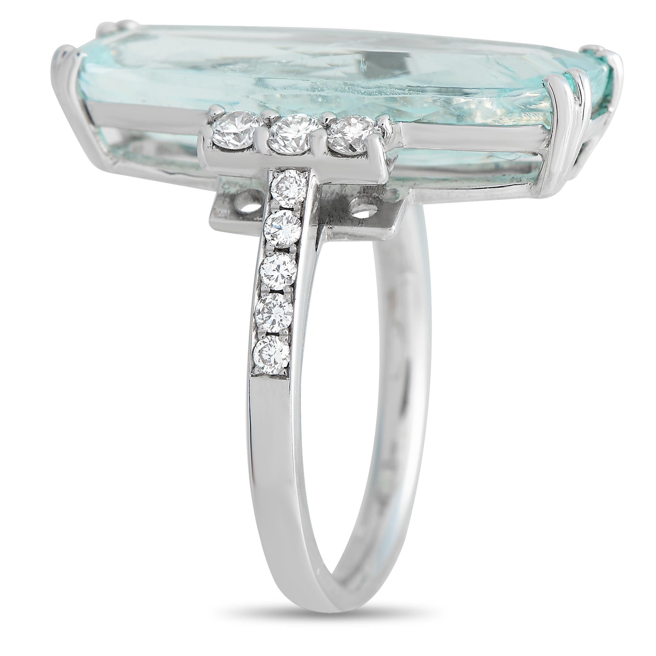 A breathtaking 10.64 carat blue paraiba tourmaline gemstone makes a statement at the center of this exquisite ring. Crafted from 18K White Gold, diamond accents with a total weight of 0.35 carats add a touch of extra elegance. This piece features a