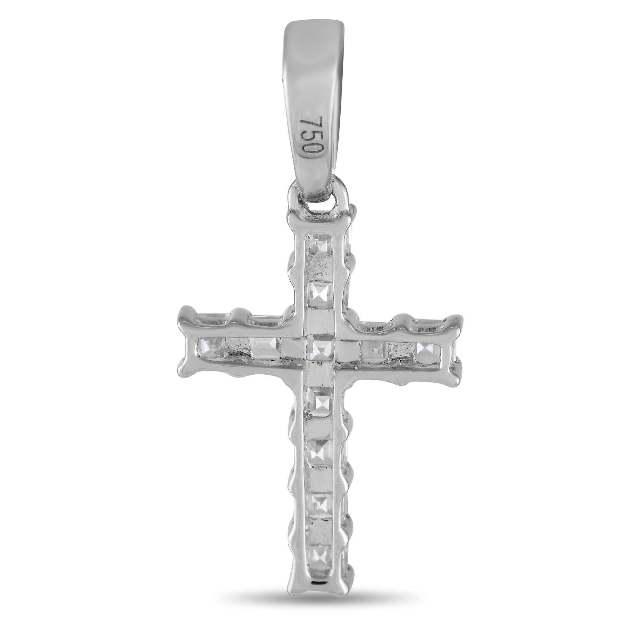 This cross shaped pendant is incredibly elegant. Crafted from 18K White Gold, it measures 0.75 long by 0.45 wide and is covered in Diamonds totaling 0.37 carats.This jewelry piece is offered in brand new condition and includes a gift box.