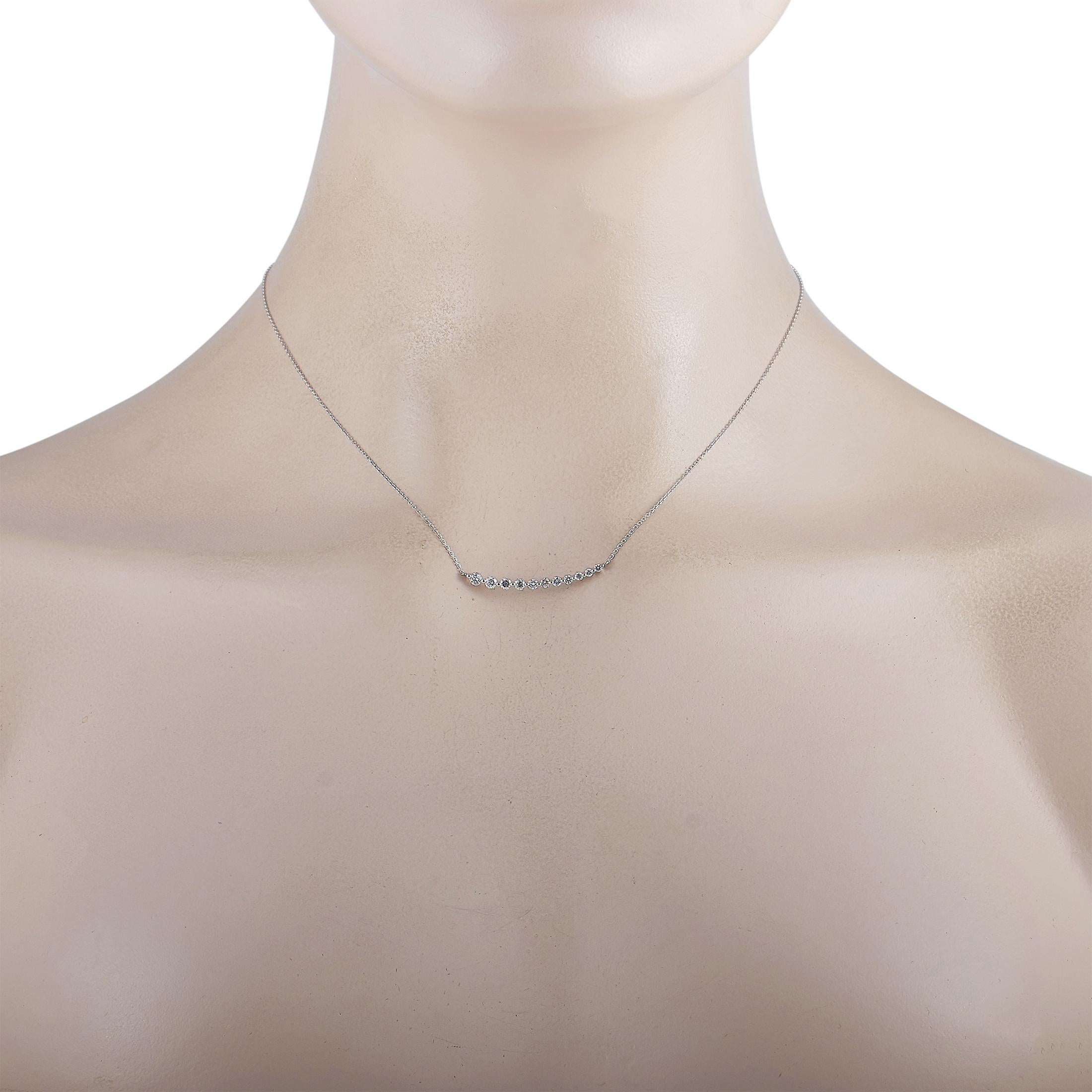 This LB Exclusive necklace is crafted from 18K white gold and weighs 2.2 grams. It is presented with a 16” chain and a pendant that measures 0.12” in length and 1.25” in width. The necklace is embellished with diamonds that total 0.50 carats.
 
