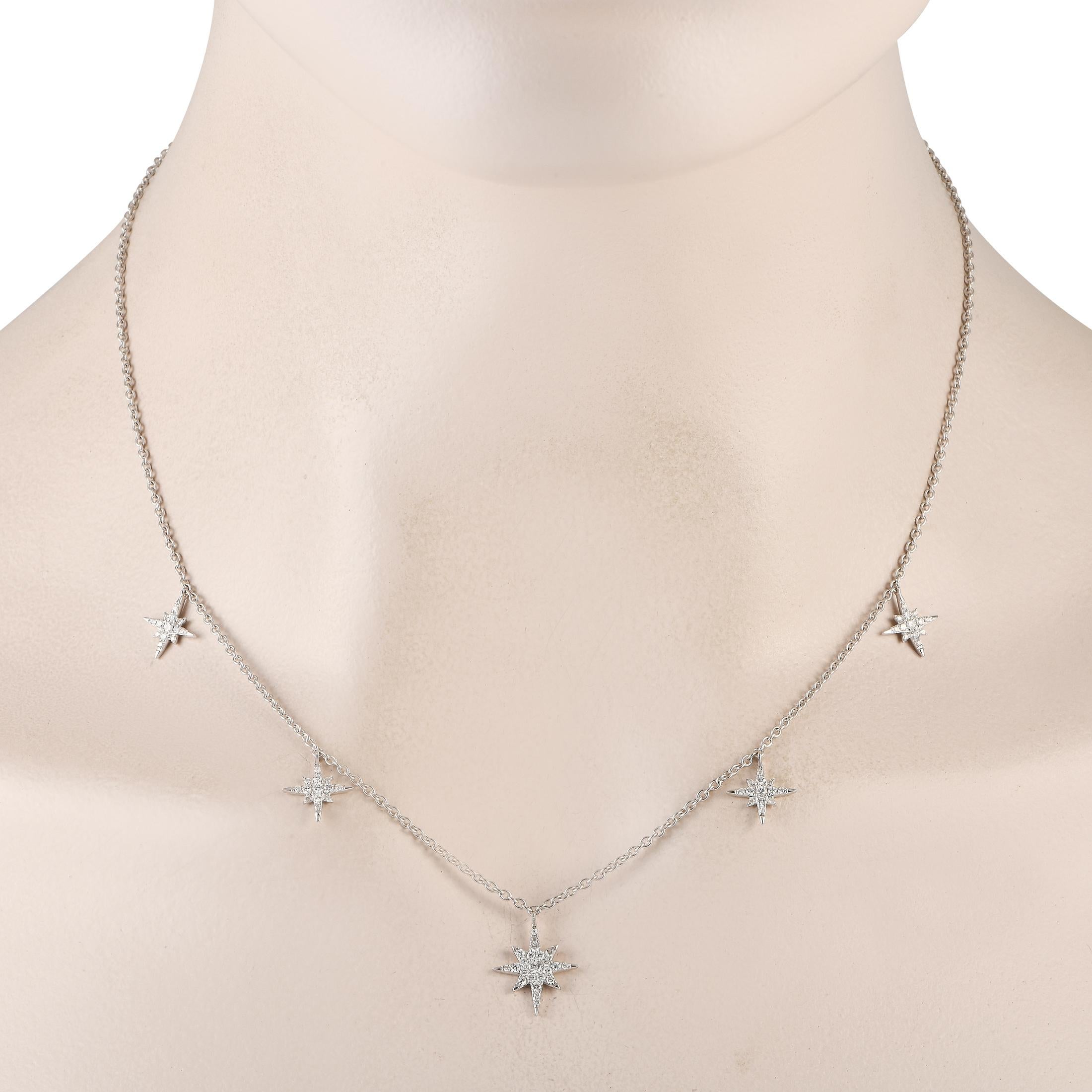 A series of star-shaped pendants covered in sparkling diamonds totaling 0.50 carats allow this 18K white gold necklace to continually catch the light. This piece features an 18 chain and a central pendant that measures 0.65 long by 0.50 wide. This