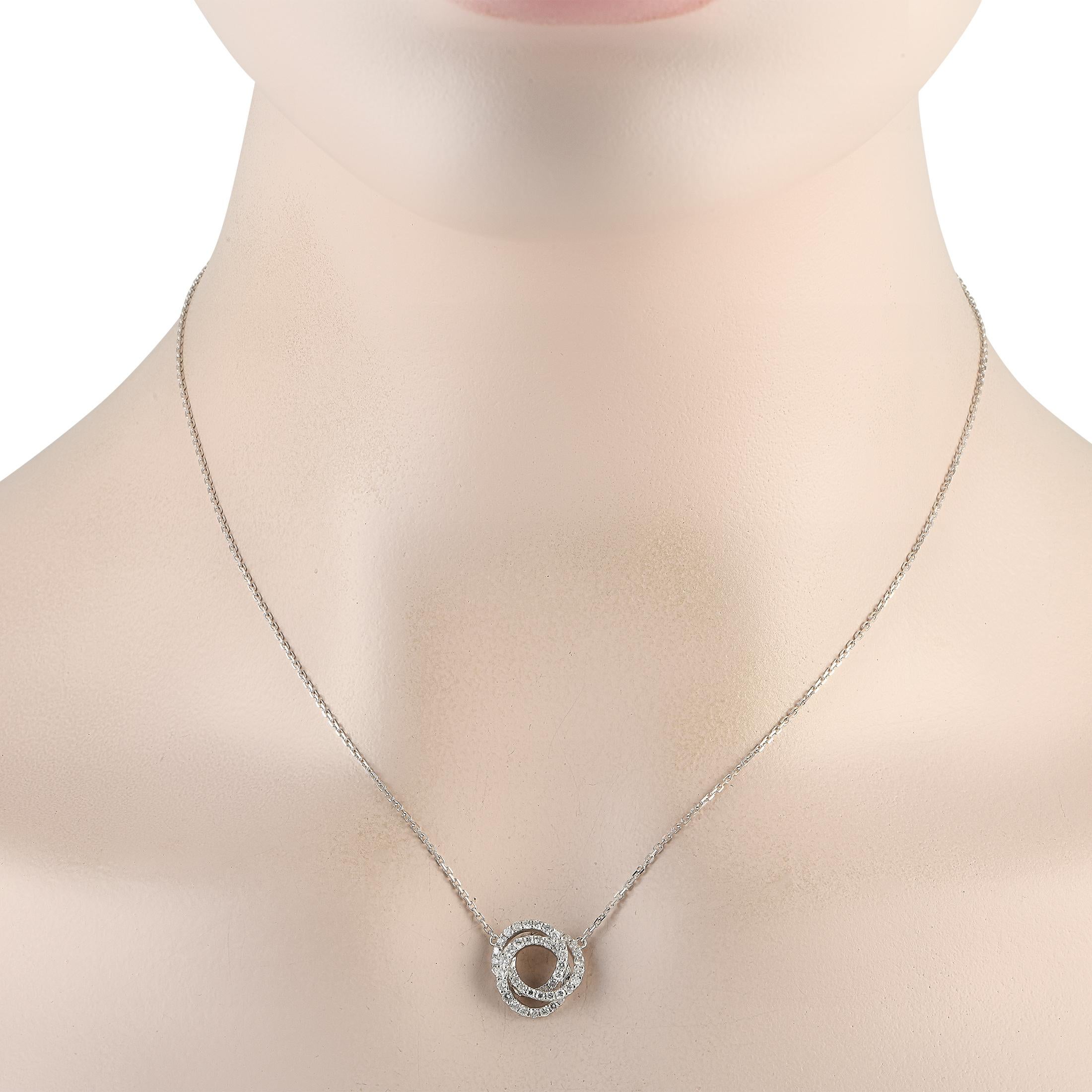 An instant stand-out, this necklace can add a sophisticated flair to your wardrobe. It is made from 18K white gold and has three interlocking rings for its pendant. Each ring is outlined with round diamonds for a captivating sparkle.Offered brand
