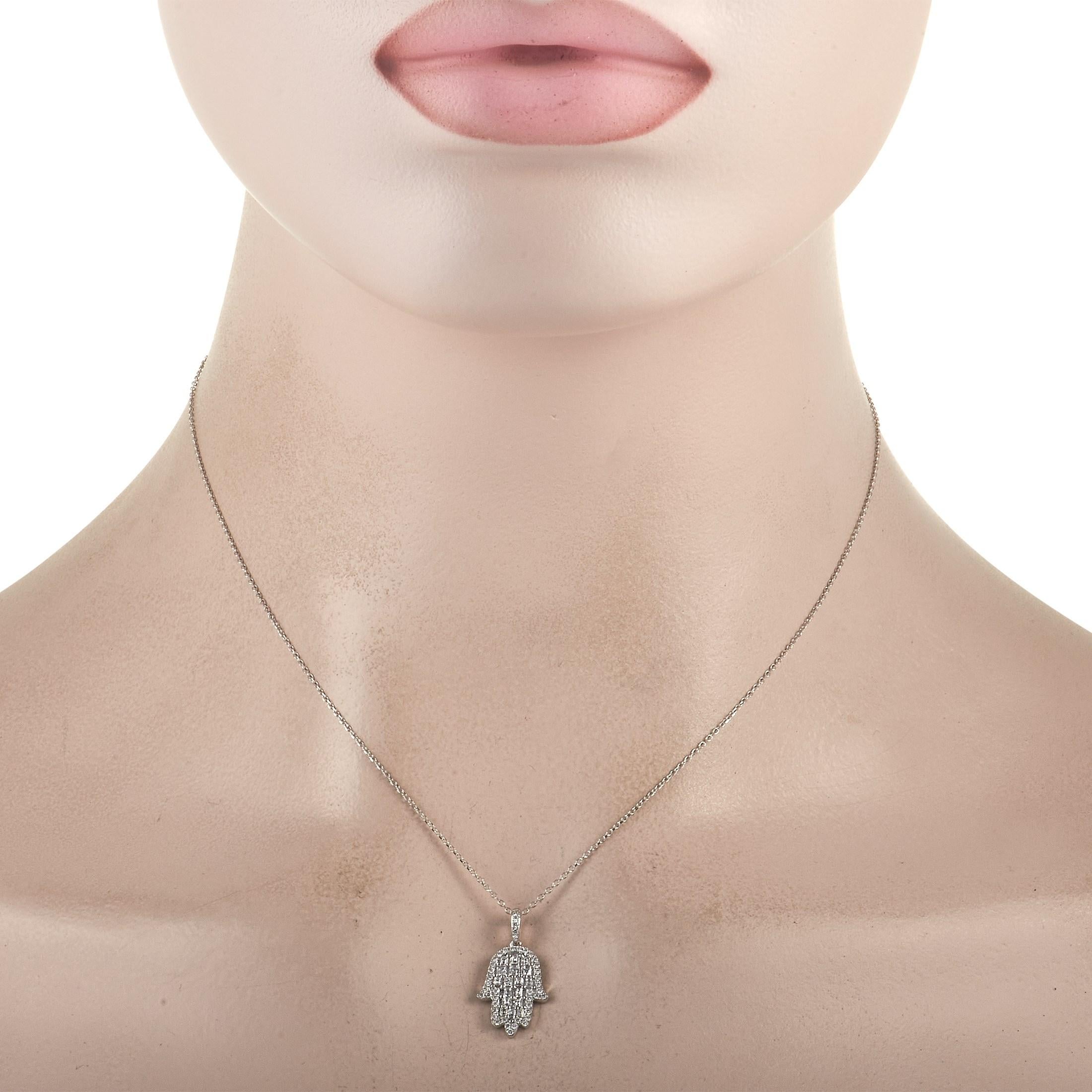 The Hamsa - a spiritual symbol of protection against evil spirits – shines to life on this exquisite necklace thanks to a shimmering 18K White Gold pendant measuring 0.75” long and 0.5” wide. A combination of Ascher cut diamonds totaling 0.38 carats