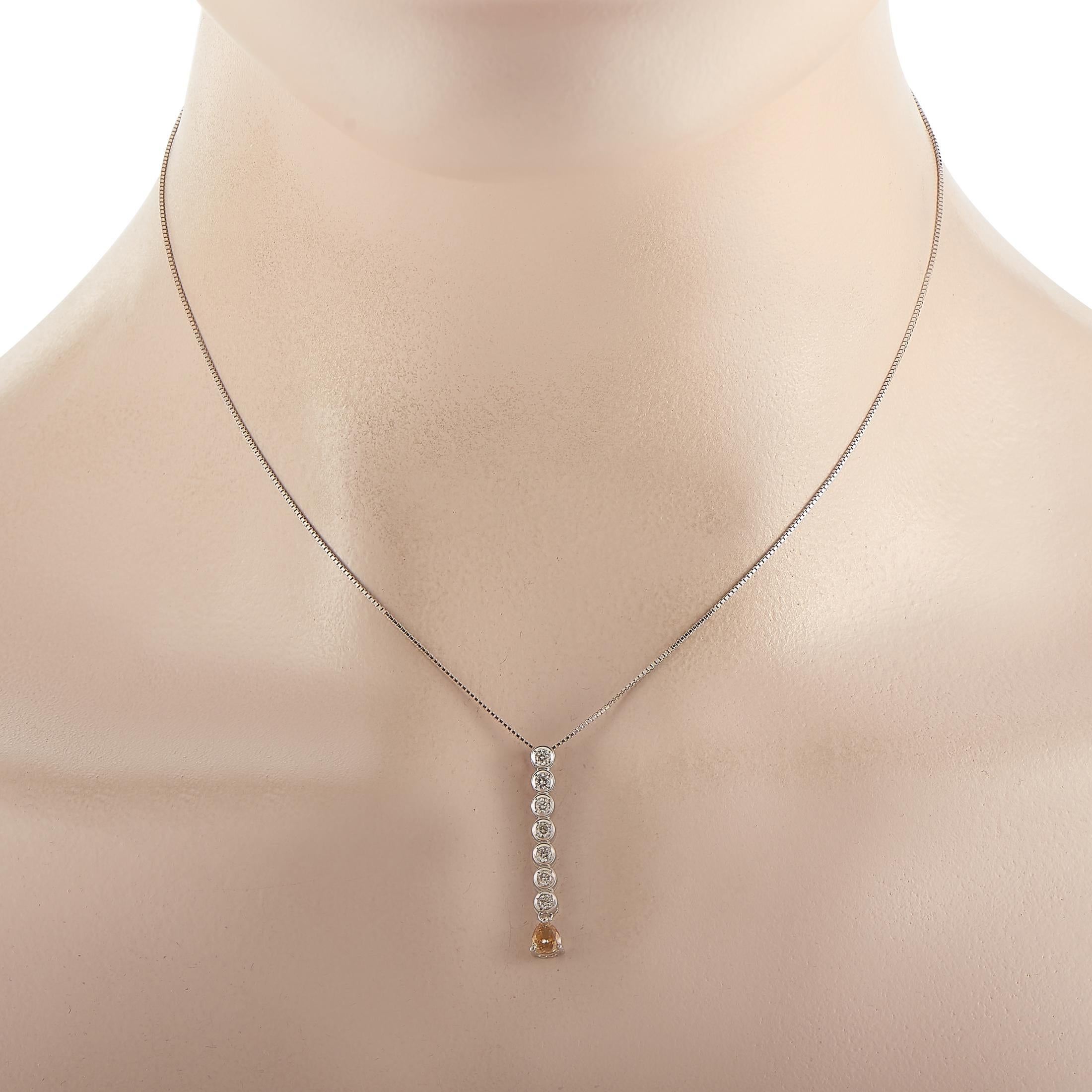This sleek pendant necklace boasts a contemporary sense of style. On the 18K White Gold pendant - which measures 1.15” long and .15” wide - you’ll find a series of bezel-set white diamonds with a total weight of 0.28 carats. A 0.27 carat brown