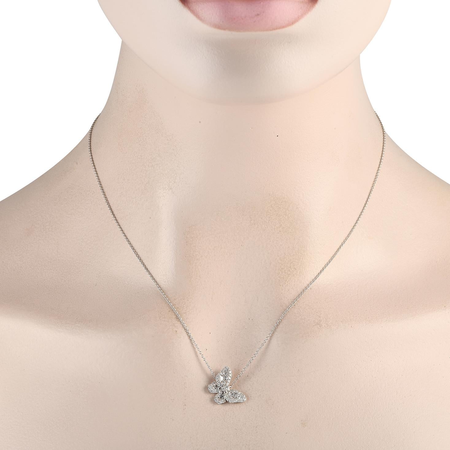 A shimmering butterfly pendant measuring 0.65 round serves as a stunning focal point on this impeccably crafted 18K white gold necklace. Suspended from a delicate 18 chain, its covered in asscher-cut diamonds totaling 0.30 carats and additional