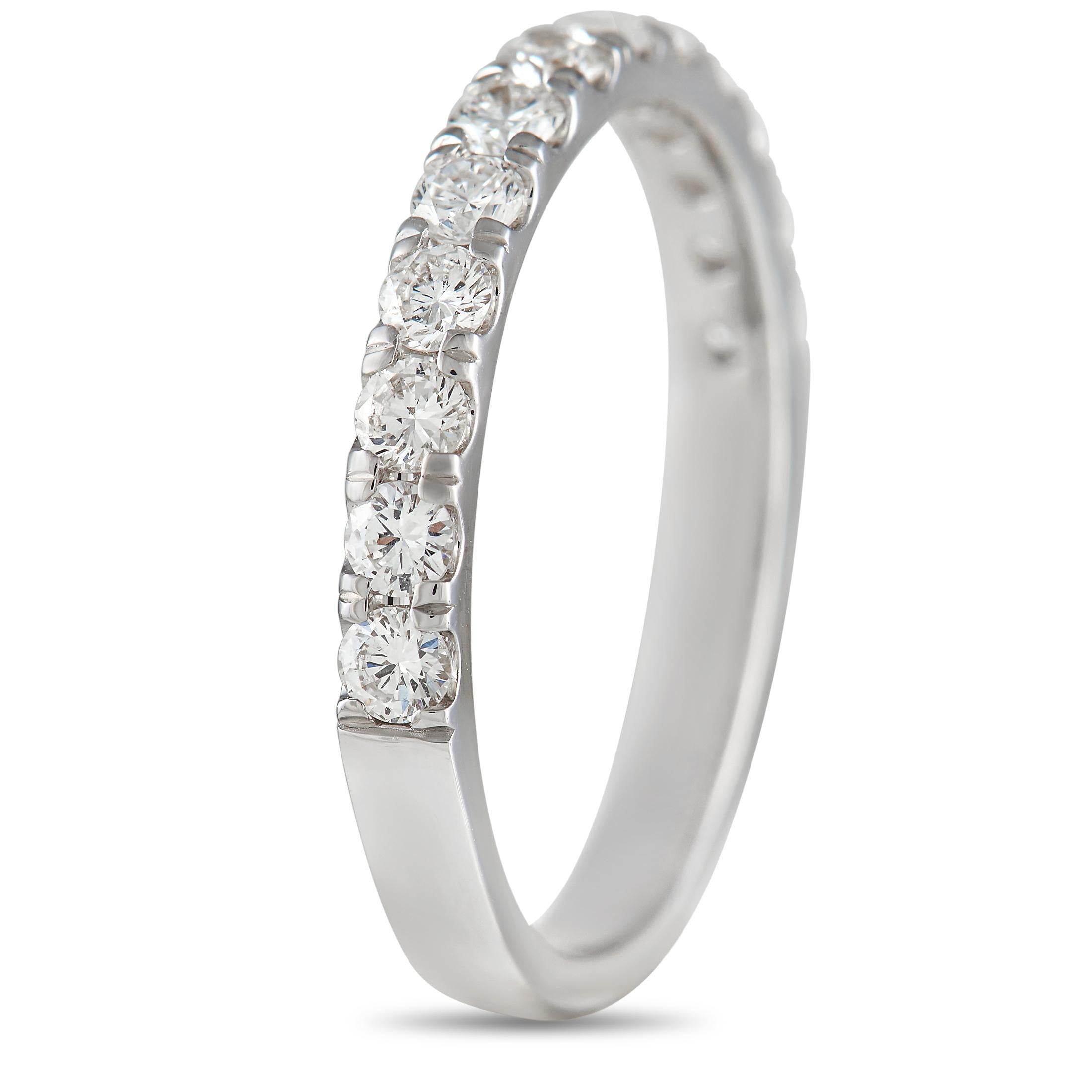 This luxurious 18K White Gold ring is sleek, stylish, and incredibly sophisticated. The top of the minimalist band – which measures 2mm wide – is covered in a series of sparkling diamonds totaling 0.59 carats. A slight 1mm top height makes it a