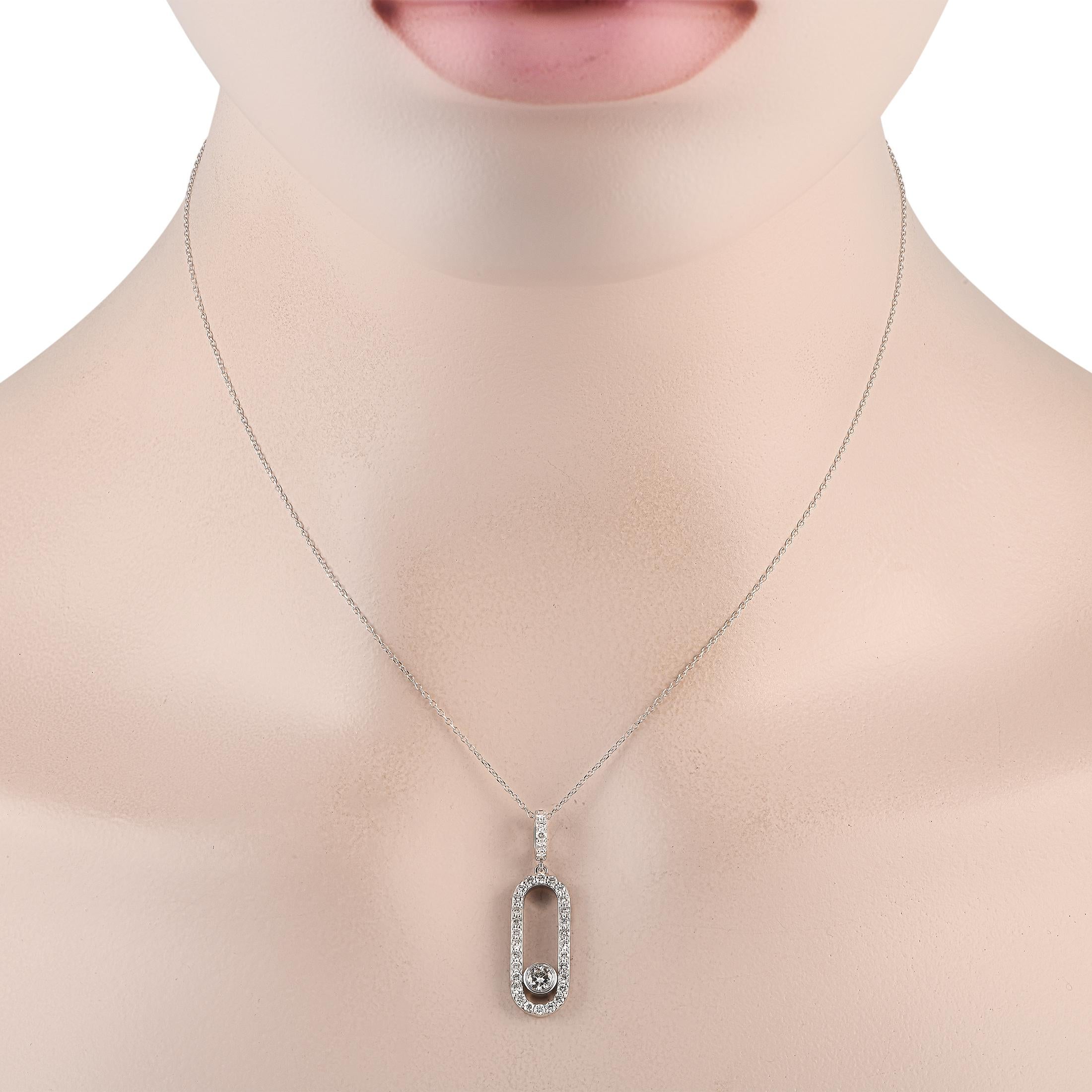 This exquisite necklace will effortlessly elevate any ensemble. Suspended from a 16” chain, a sleek pendant shines to life thanks to sparkling diamonds with a total weight of 0.70 carats. The pendant is crafted from 18K White Gold and measures 1.25”