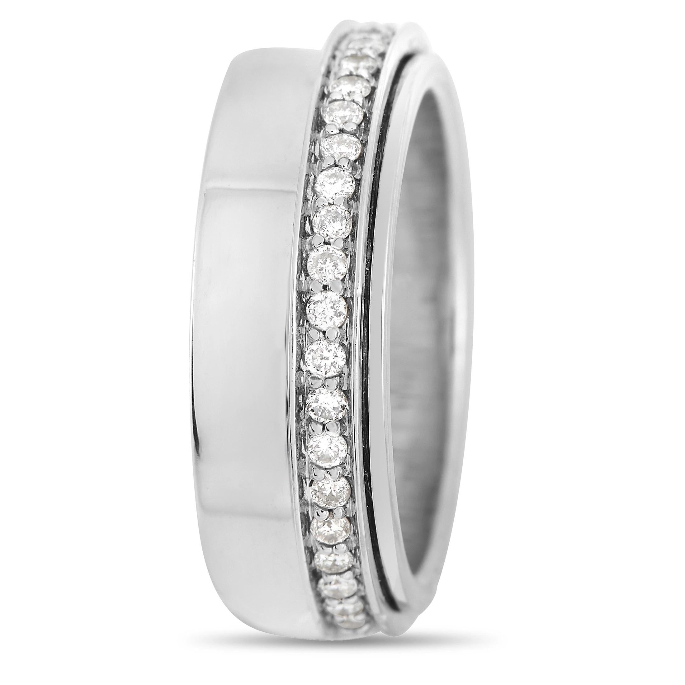 A striking 18K White Gold setting sets this ring apart in the best way possible. Adorned with a band of diamonds totaling 0.75 carats, it measures 6mm wide and possess a chic, sophisticated sense of style. 
 
 This jewelry piece is offered in