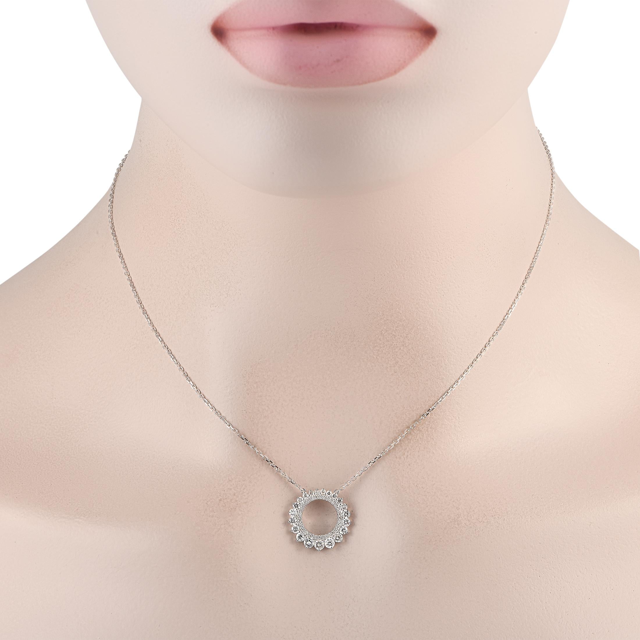 A double halo of diamonds totaling 0.75 carats make this simple, sophisticated necklace simply unforgettable. Suspended at the center of a sleek 15” chain, you’ll find a stunning 18K White Gold circular pendant measuring 0.65” round. 
 
This jewelry