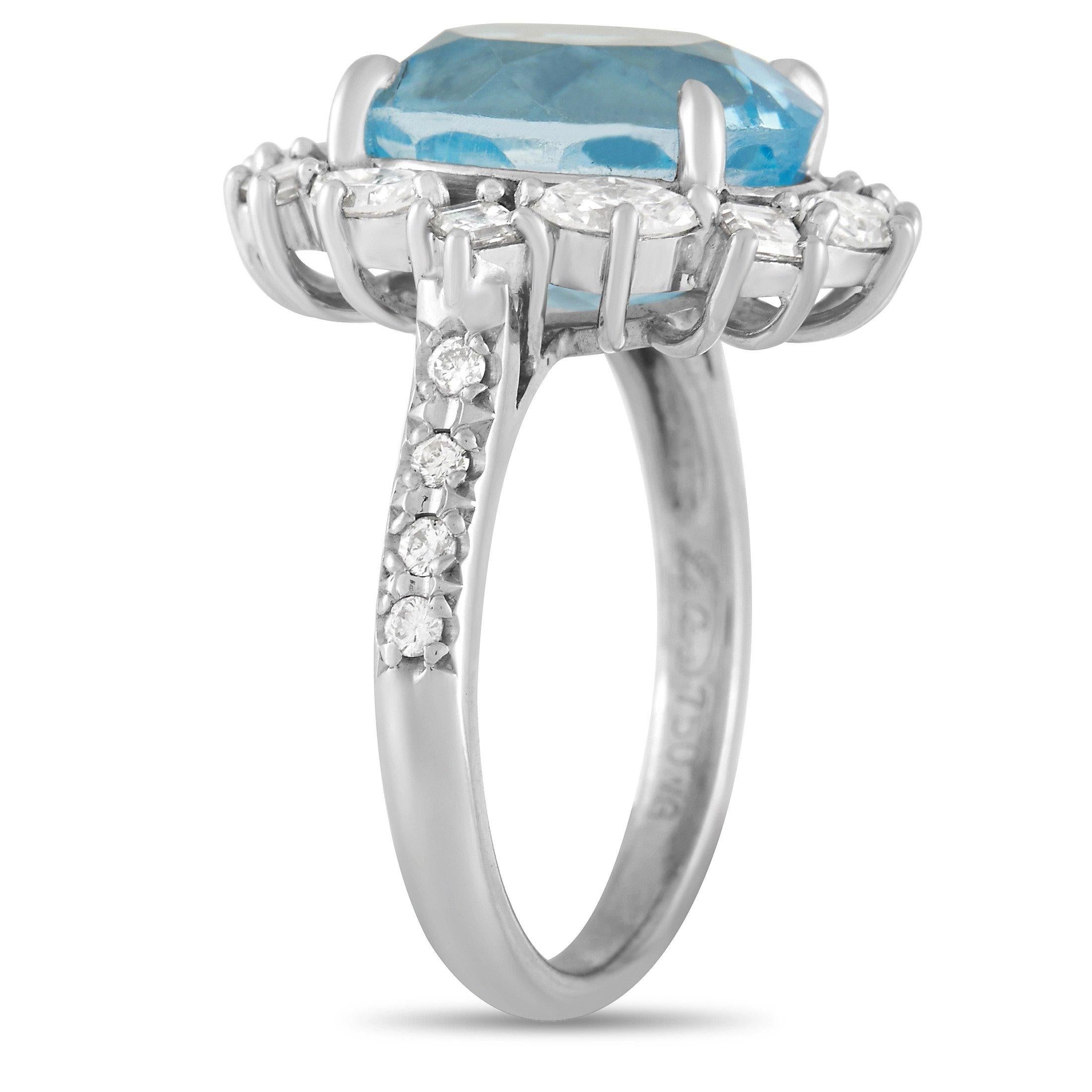 A sparkling blue 6.54 carat Topaz center stone makes this elegant ring simply sensational. Glittering diamonds totaling 0.93 carats accent the halo and 2mm wide band of this 18K White Gold ring, which features a stylish 7mm top height. 
 
 This