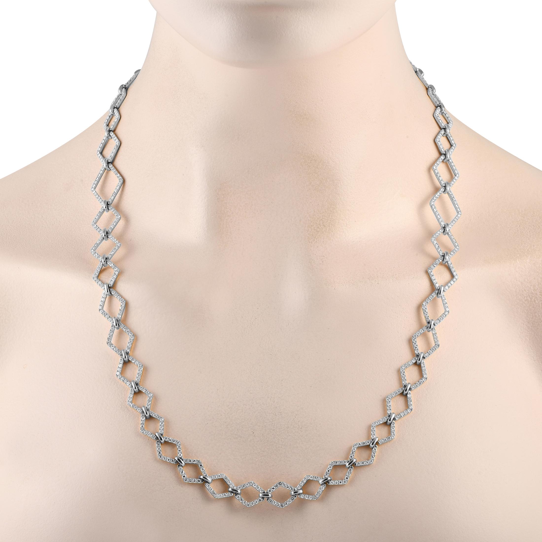 This stunning 18K White Gold necklace features a delicate yet dramatic design. Accented by negative space and sparkling diamonds with a total weight of 10.60 carats, this piece measures 24.5” long and will continually make a statement. 

This