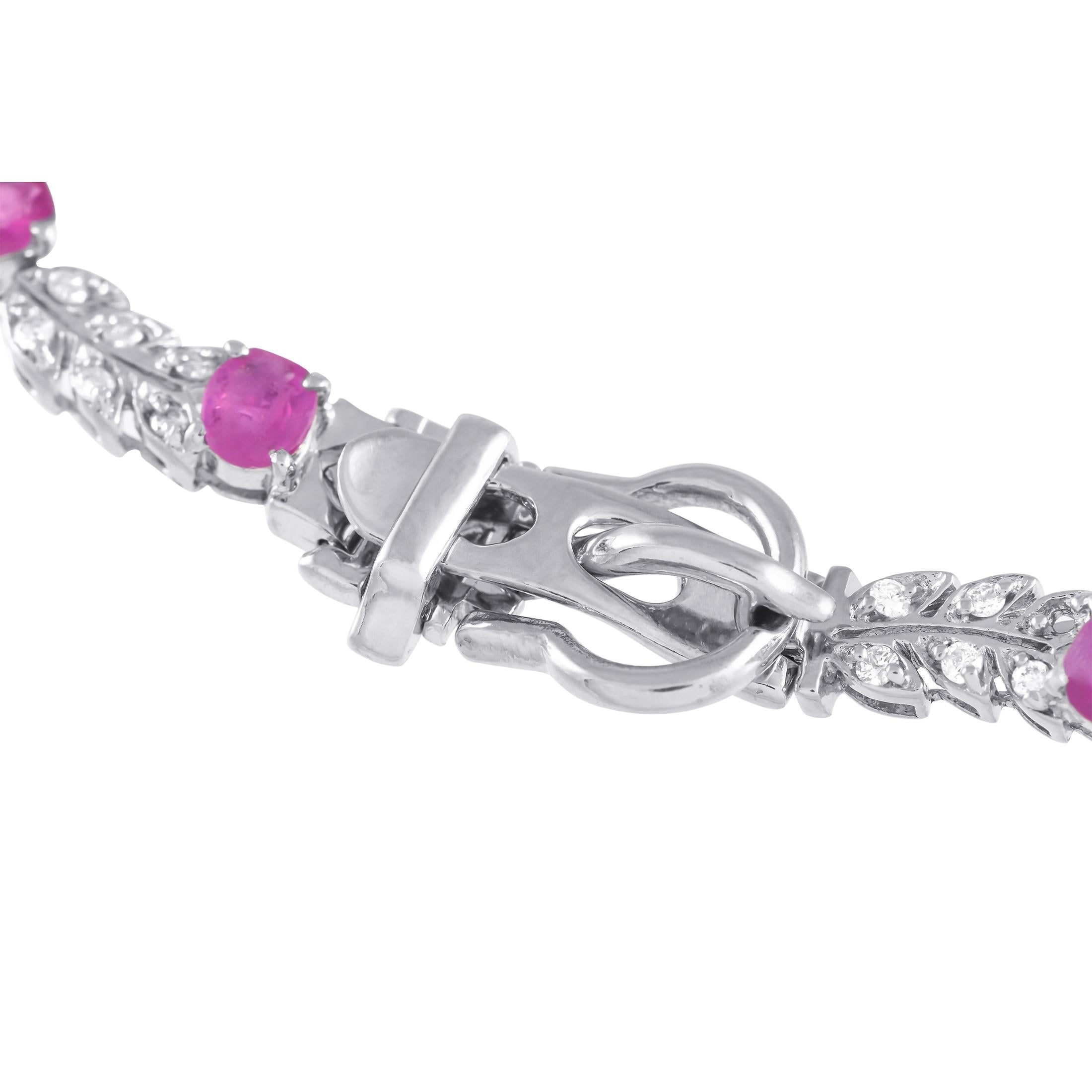 Channel a goddess' graceful beauty with this nature-inspired bracelet in 18K white gold. It features an 8-inch-long chain of leaf stems, with each leaf dotted with a diamond. Oval-cut rubies are positioned at evenly-spaced stations for a touch of